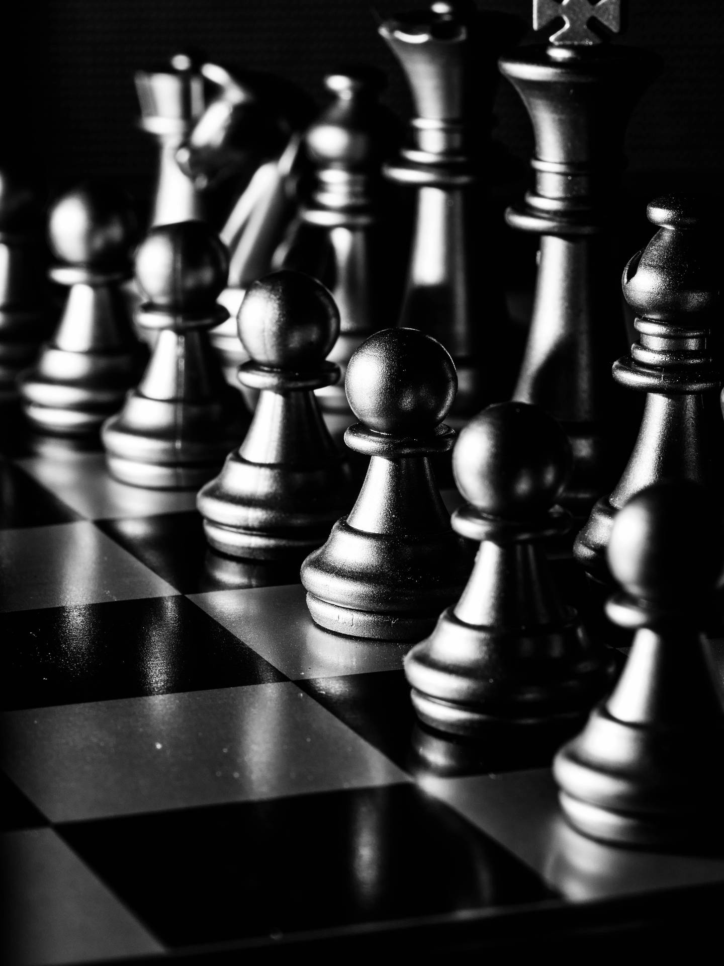 A black and white photo of a chess board - Chess
