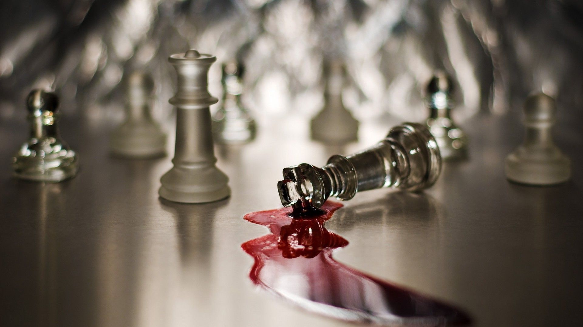 A chess piece lying on its side, surrounded by a pool of blood. - Chess