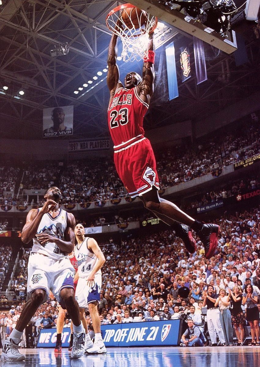 A basketball player in the air after a dunk - Michael Jordan