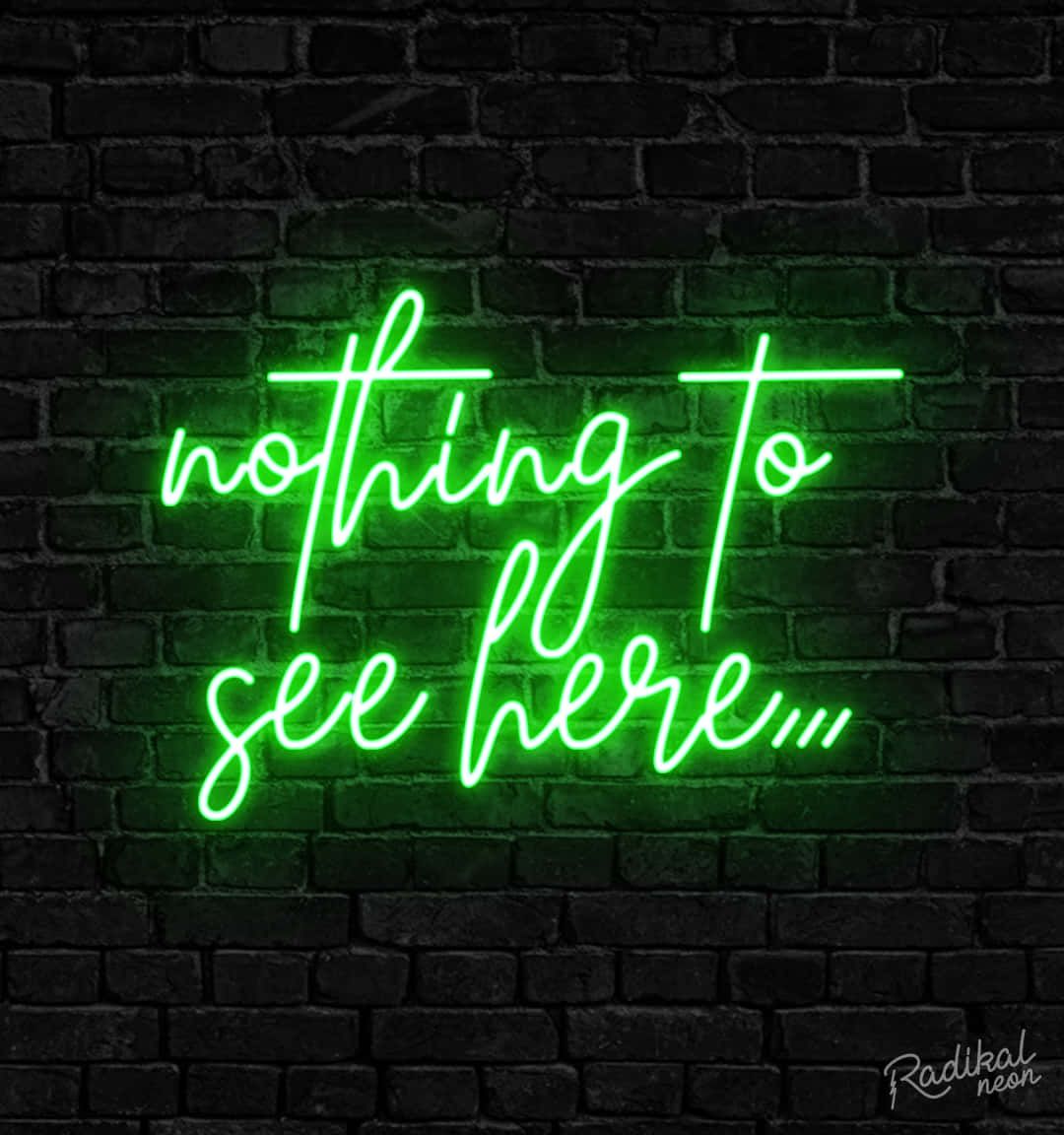 A green neon sign that reads 