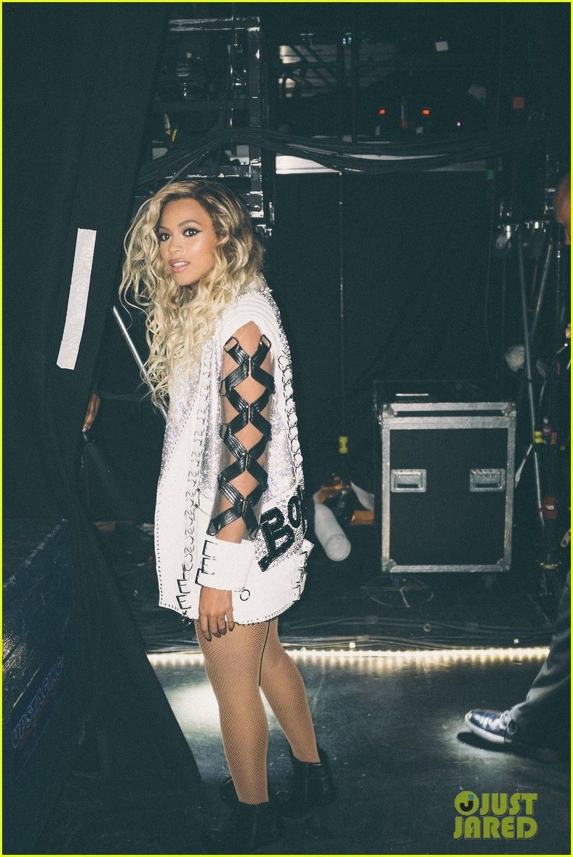 Beyoncé wears a white cut-out top and fishnets for her Formation World Tour. - Beyonce