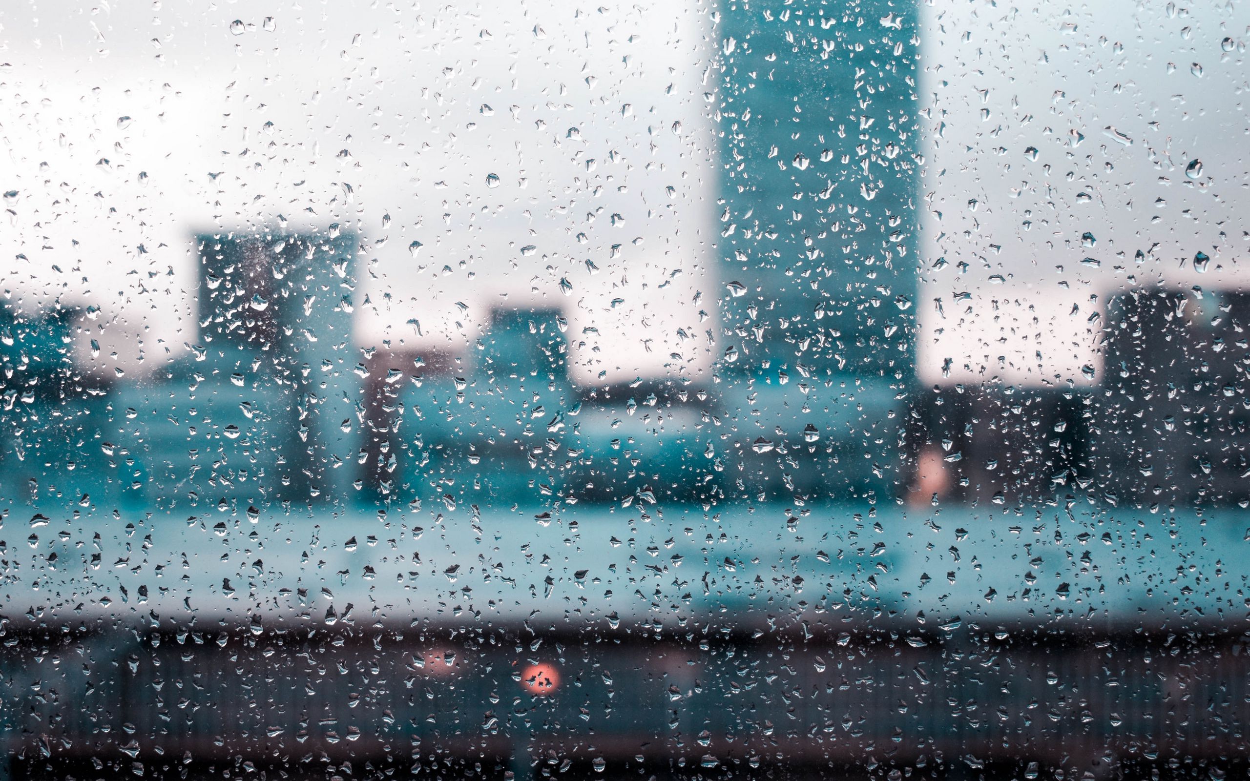 A view of the city through a rain-streaked window. - 2560x1600, rain