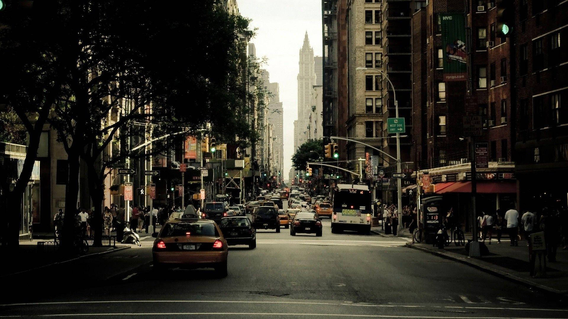 A busy city street with cars and pedestrians. - New York
