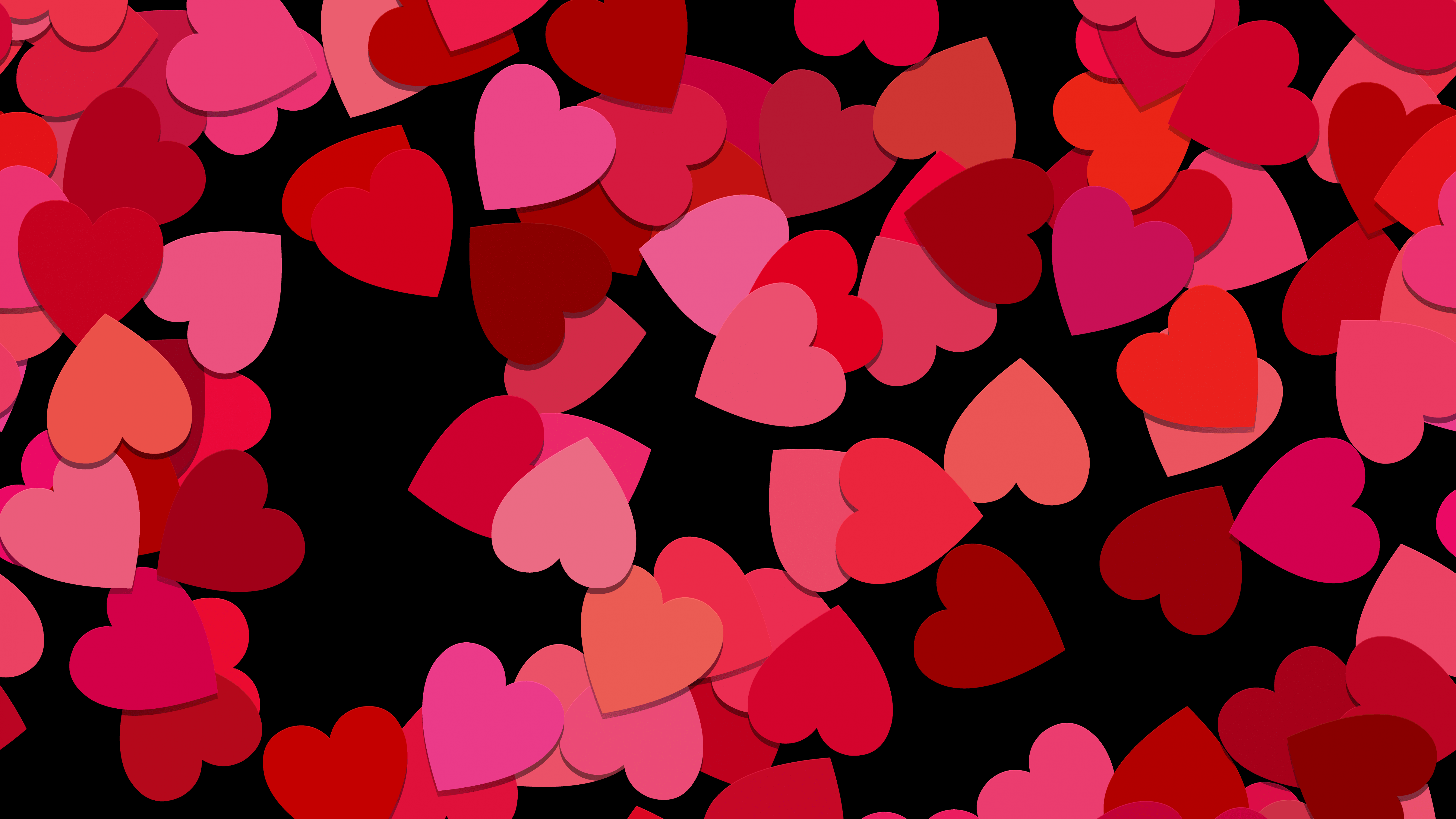 Red and pink hearts on a black background - Love