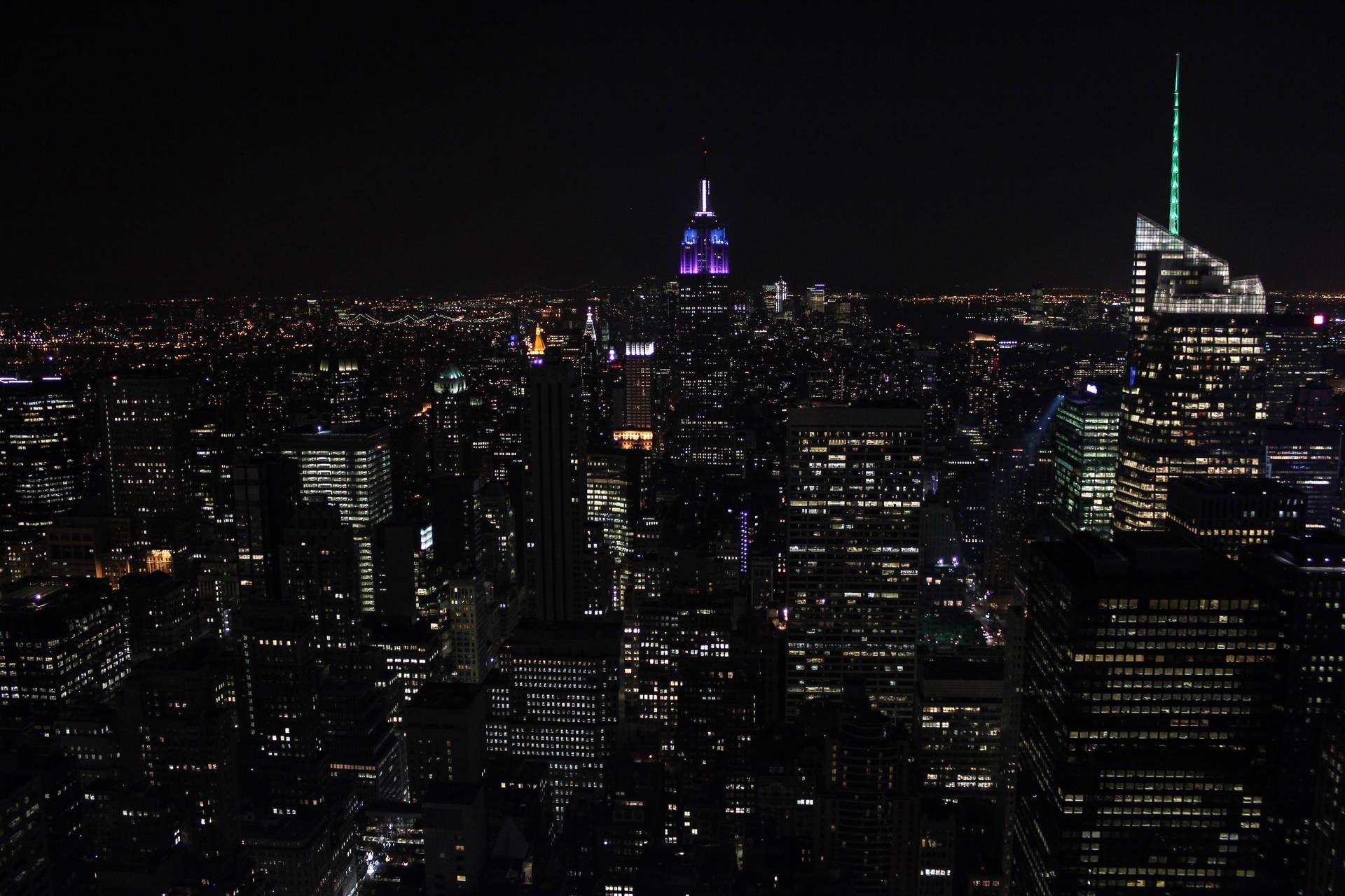 A night time view of the city from the top of the Rock. - New York