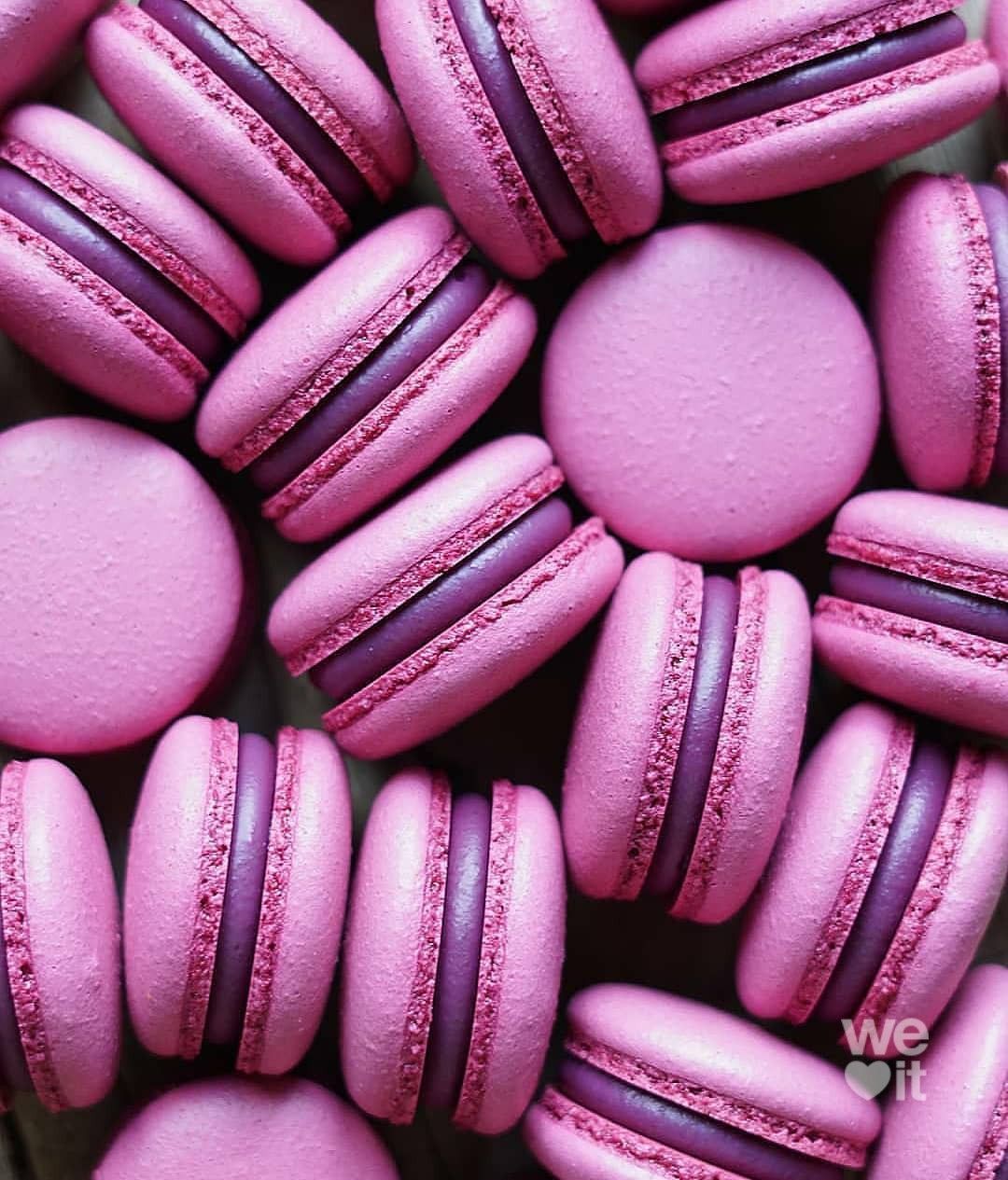 A pile of pink and purple macarons - Macarons