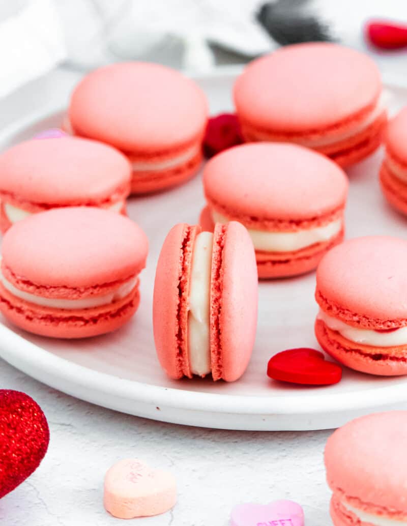 Strawberry macarons with a sweet and tangy frosting, perfect for Valentine's Day. - Macarons