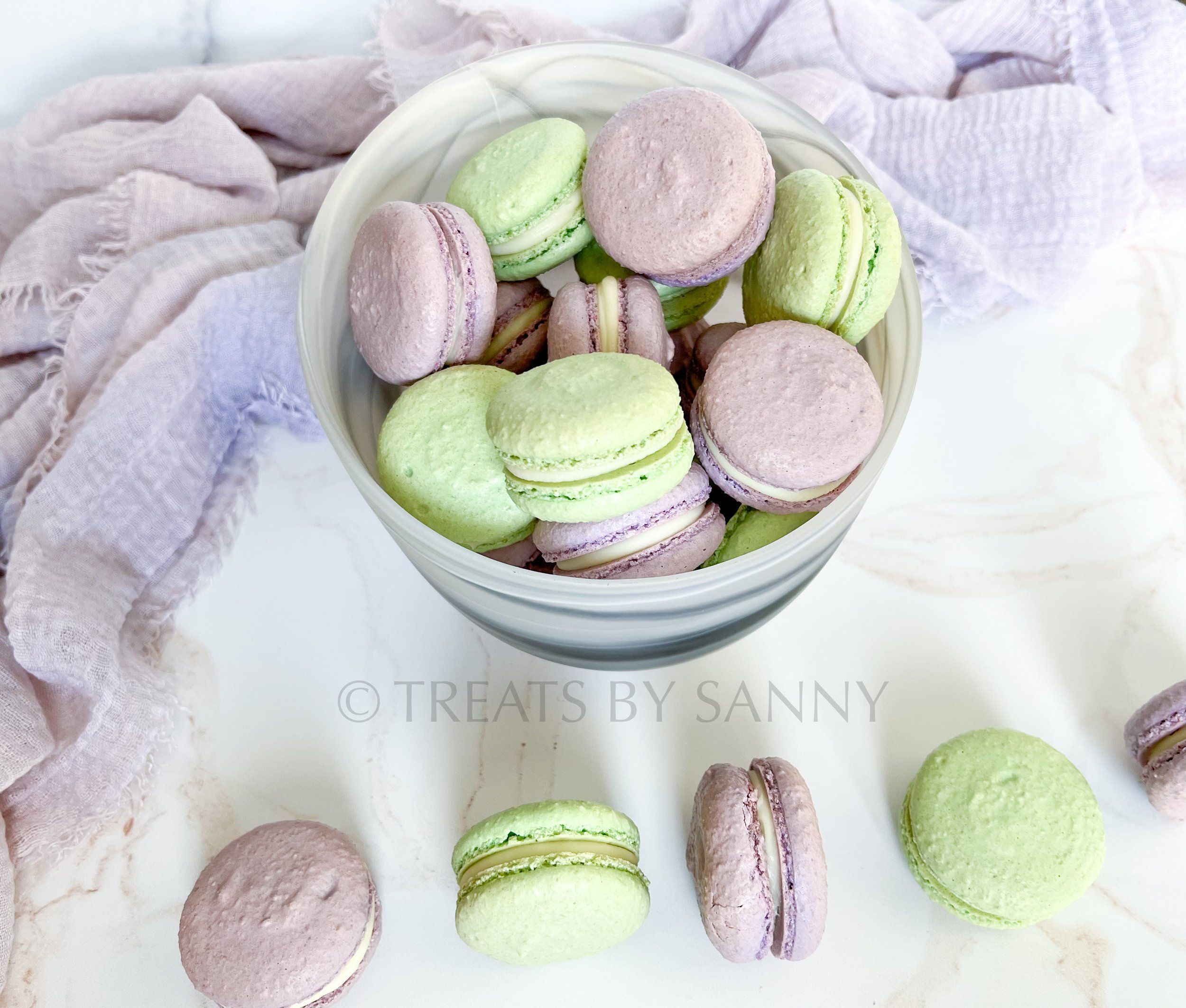 Macarons in a bowl on a white counter - Macarons