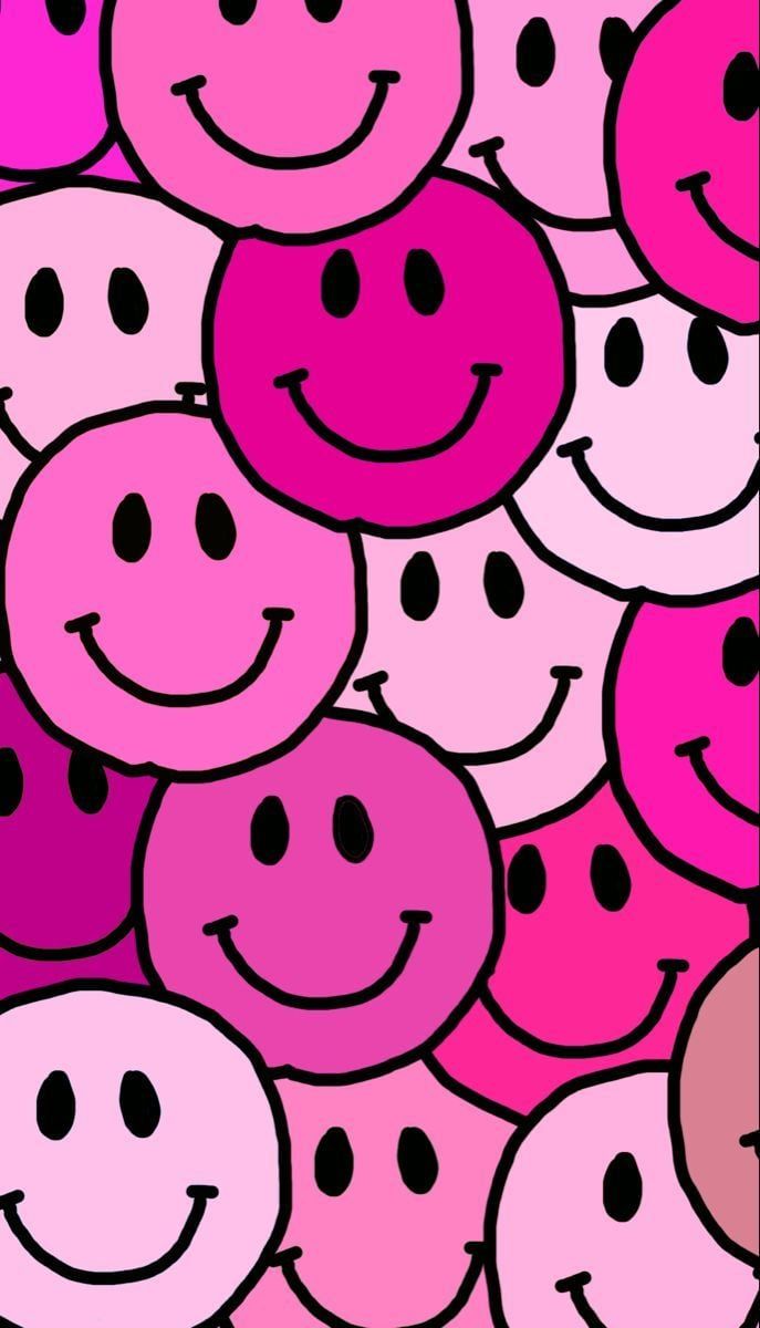 A wallpaper of pink smiley faces for a phone - Smiley