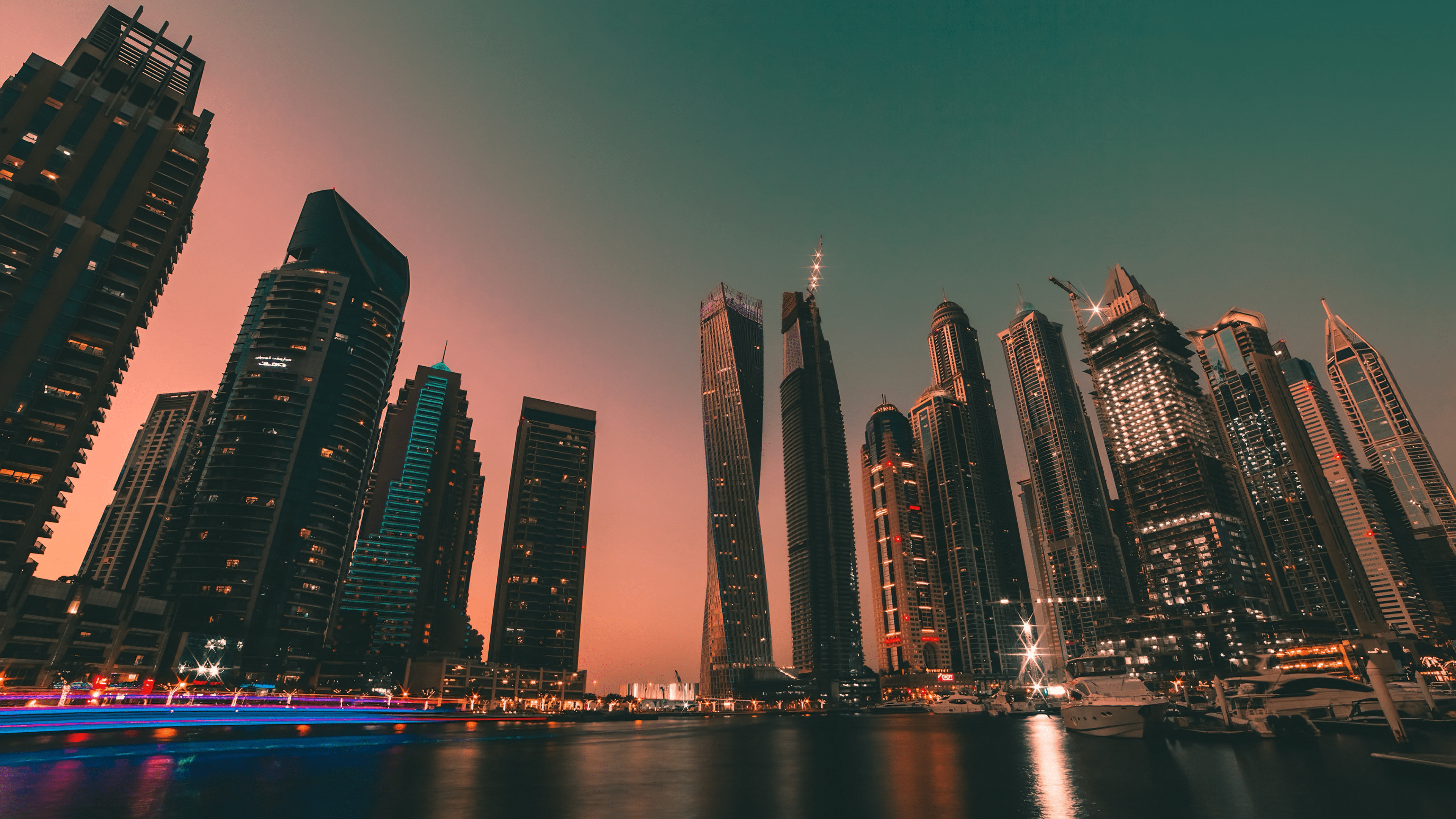 A long exposure photo of the Dubai Marina at sunset. - Dubai