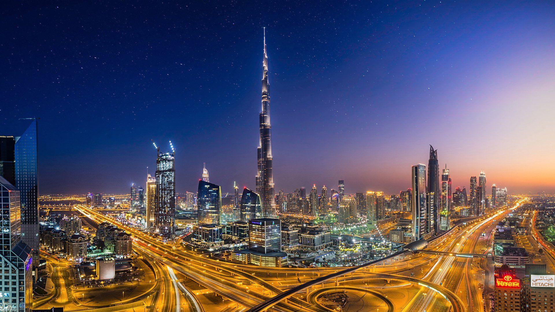 A night time view of the Burj Khalifa and the surrounding city of Dubai - Dubai