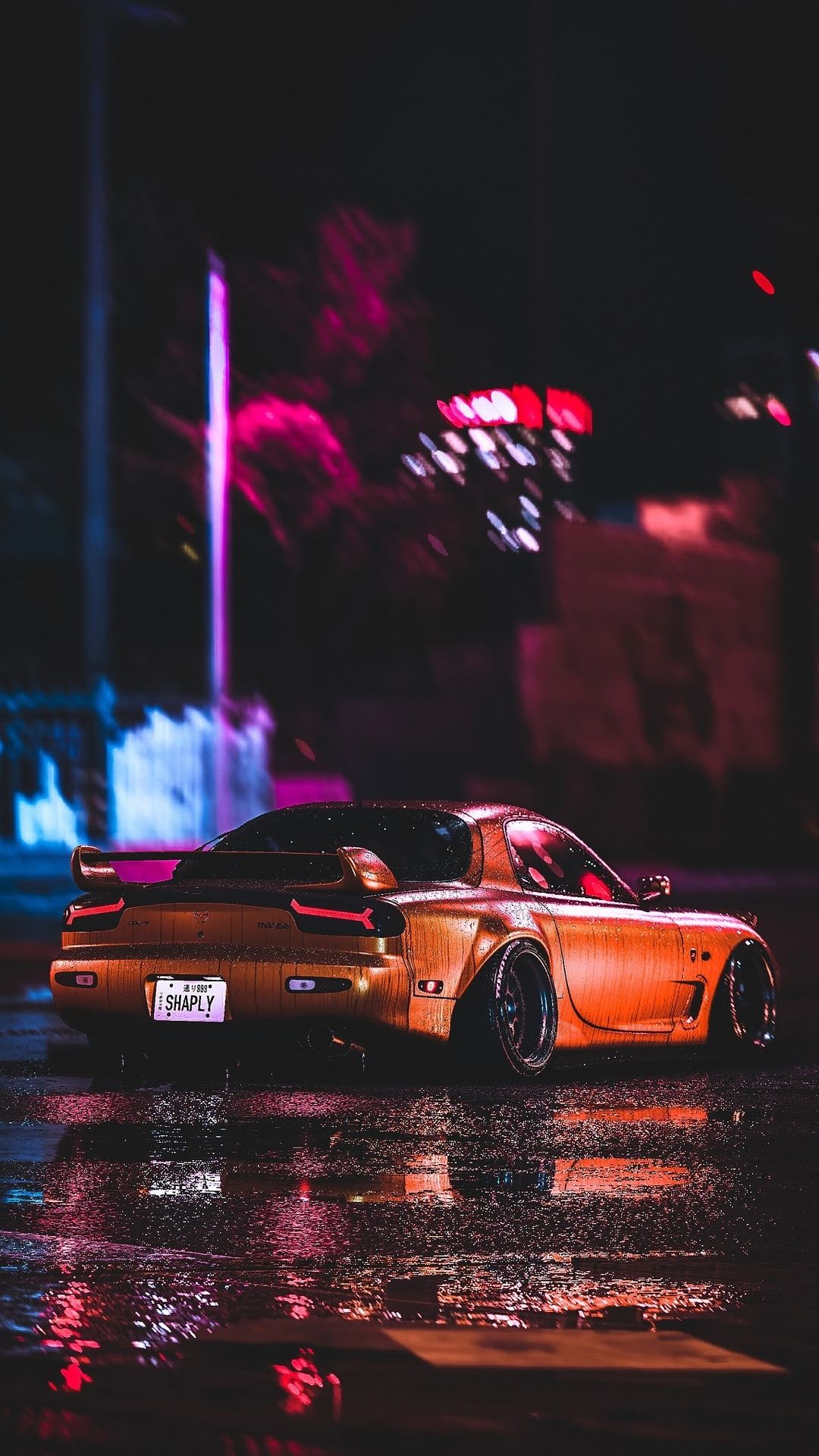 IPhone wallpaper of a gold mazda rx7 in the rain at night - Cars