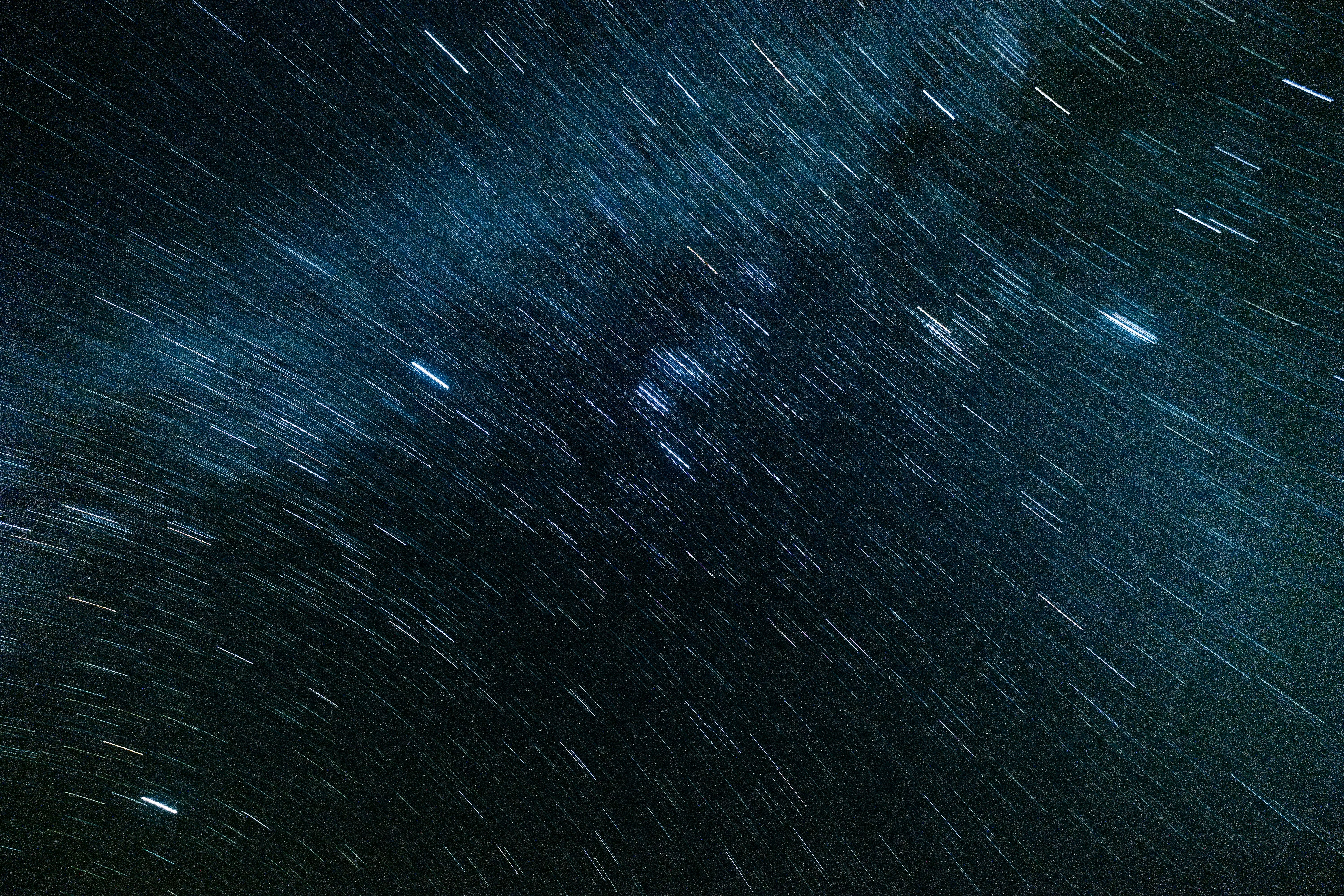 A night sky with stars and streaks - Space