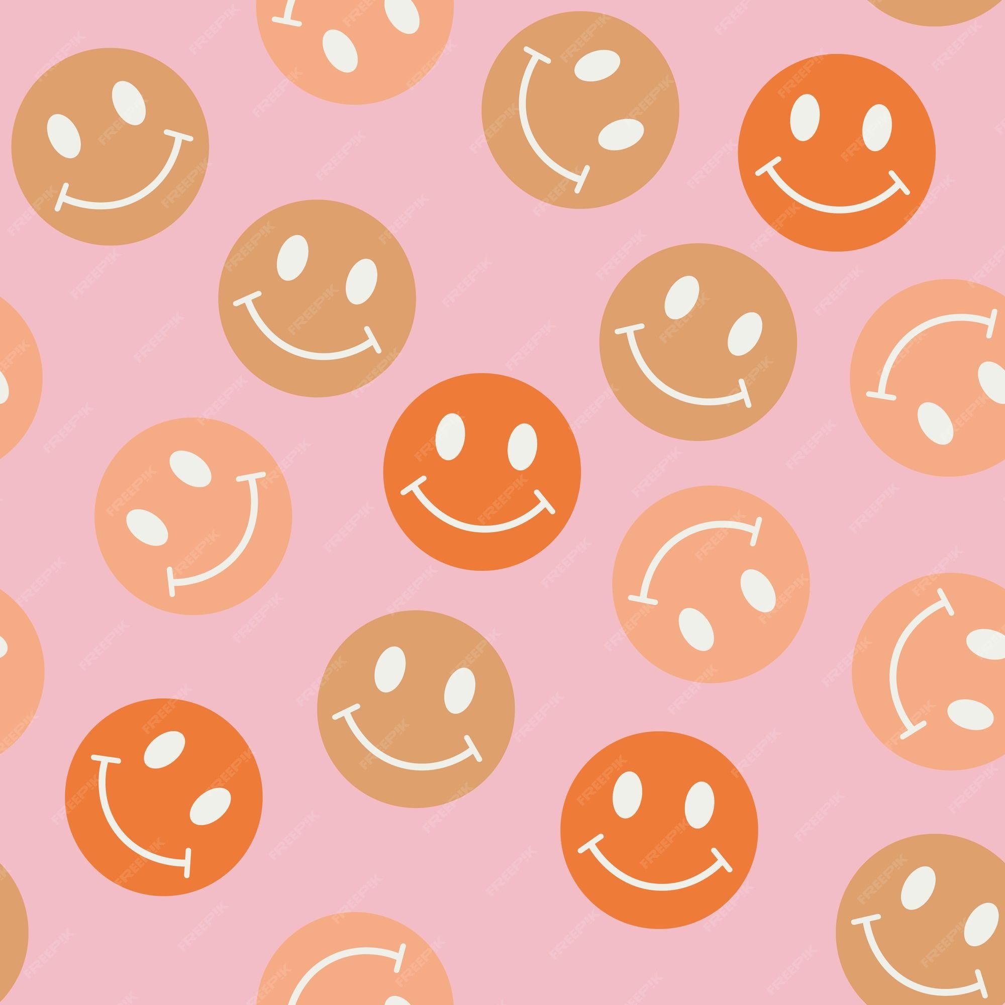 A pink background with a pattern of orange and pink smiley faces - Emoji