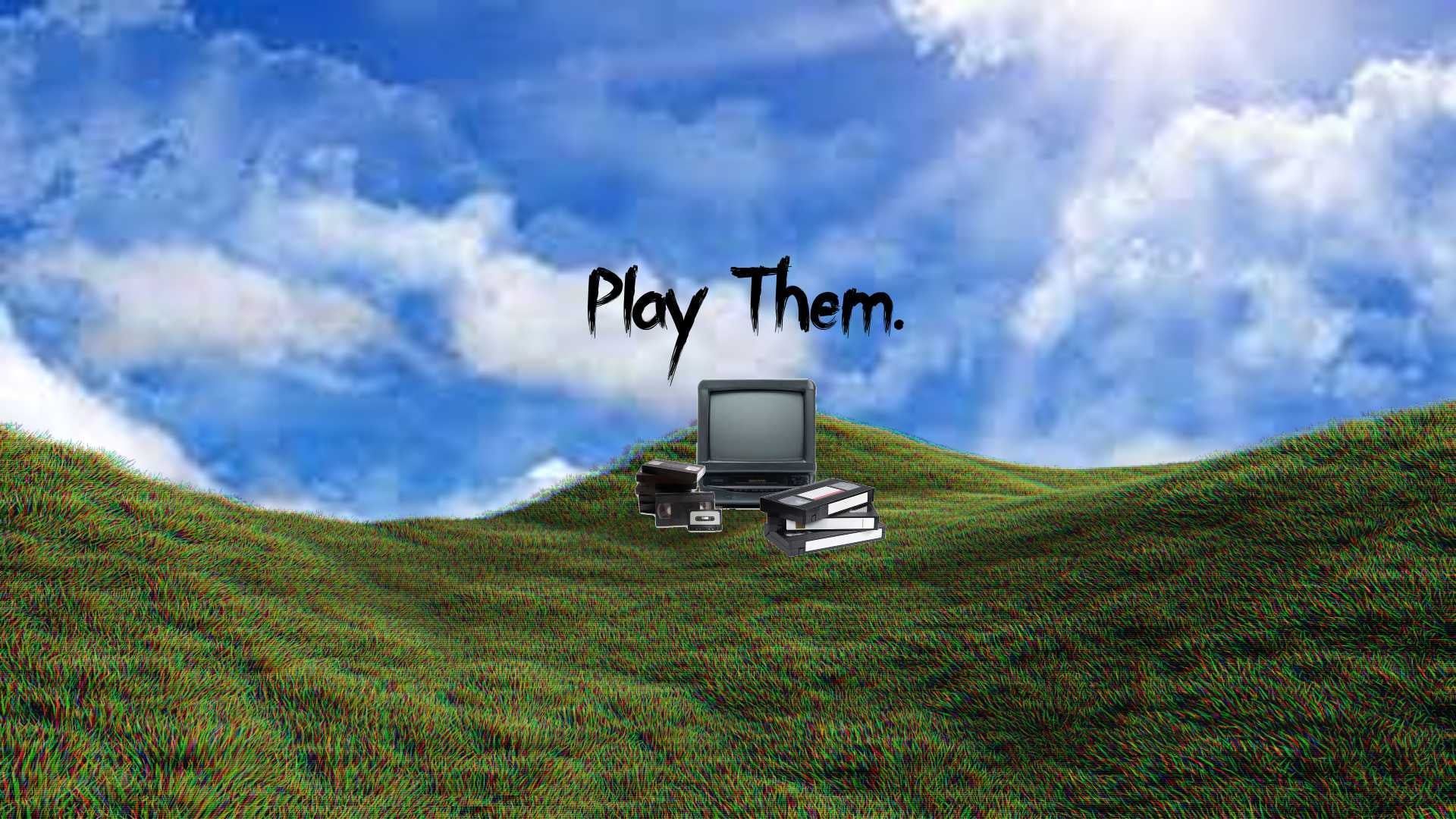 A TV sitting on top of a stack of books on a grassy hill with the words 