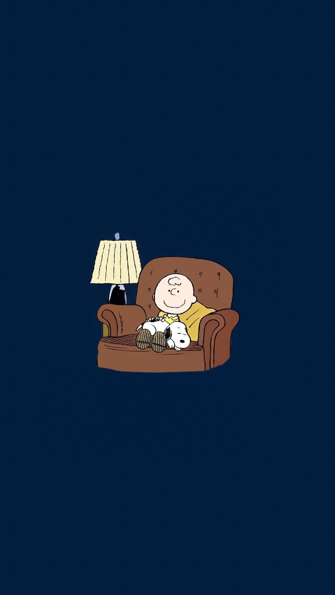 Charlie Brown sitting on a couch with a lamp on - Charlie Brown