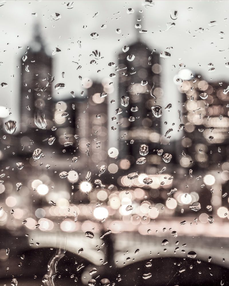 Raindrops on a window with a cityscape in the background - Silver, New York