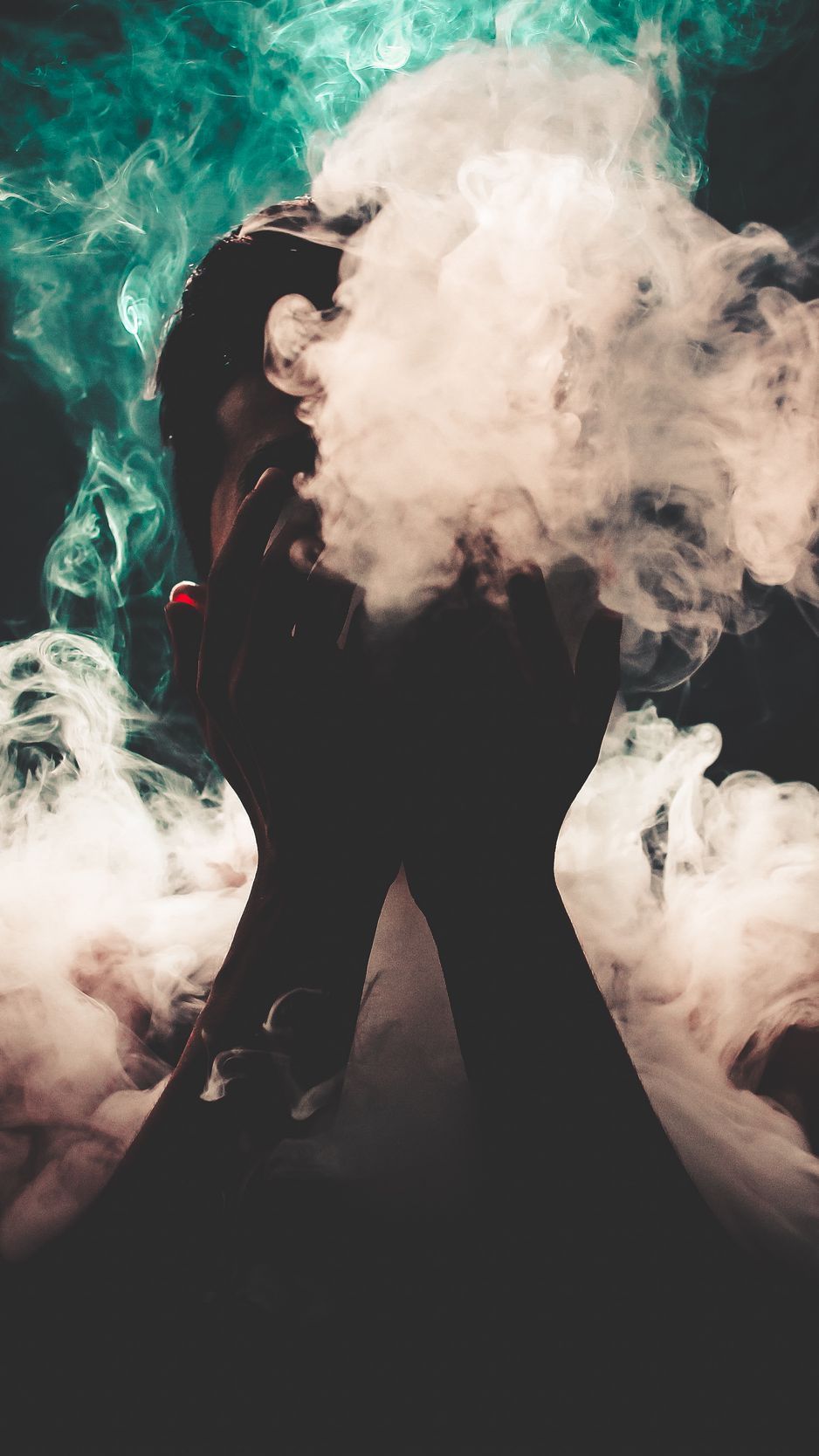 A person with a cigarette surrounded by smoke - Smoke