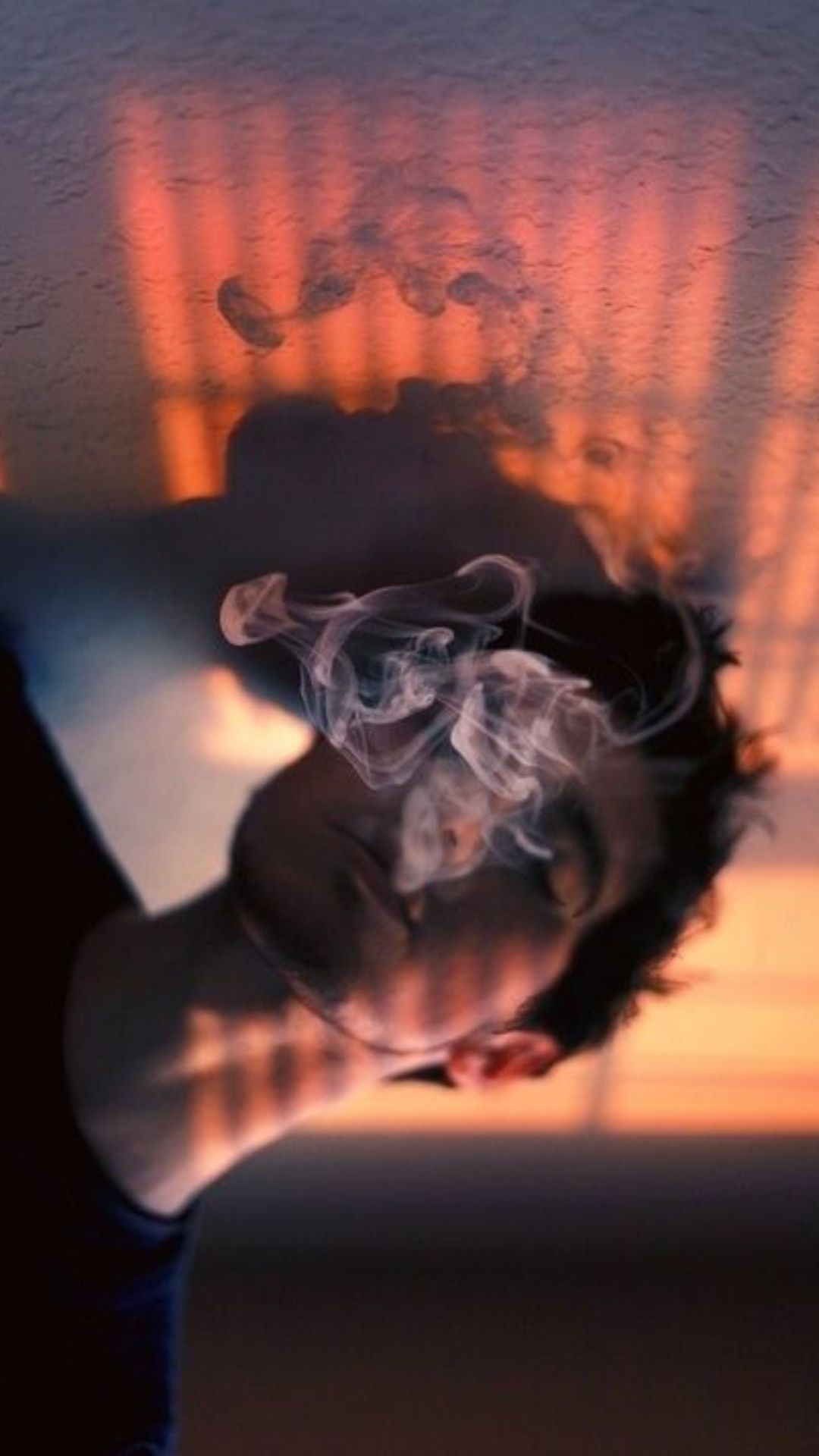A man with smoke coming out of his mouth - Smoke