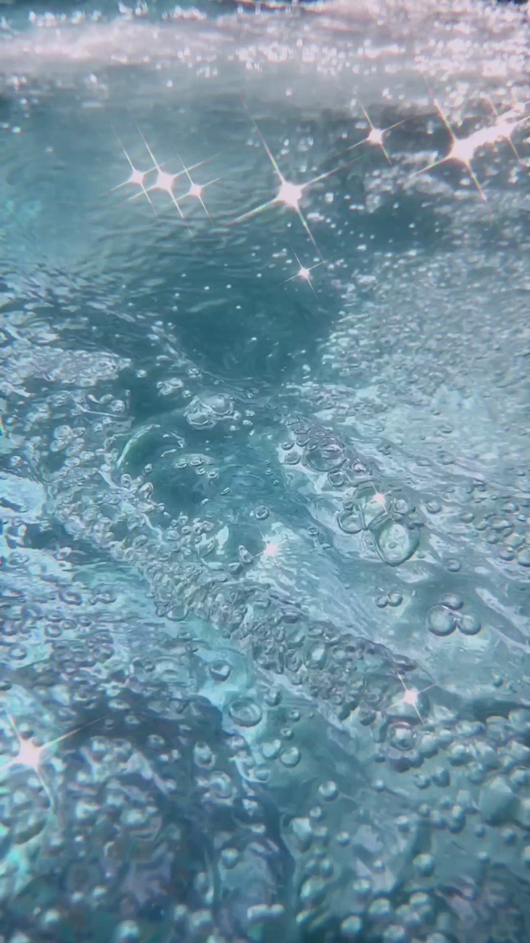 Underwater scene with bubbles and a star-like light - Water