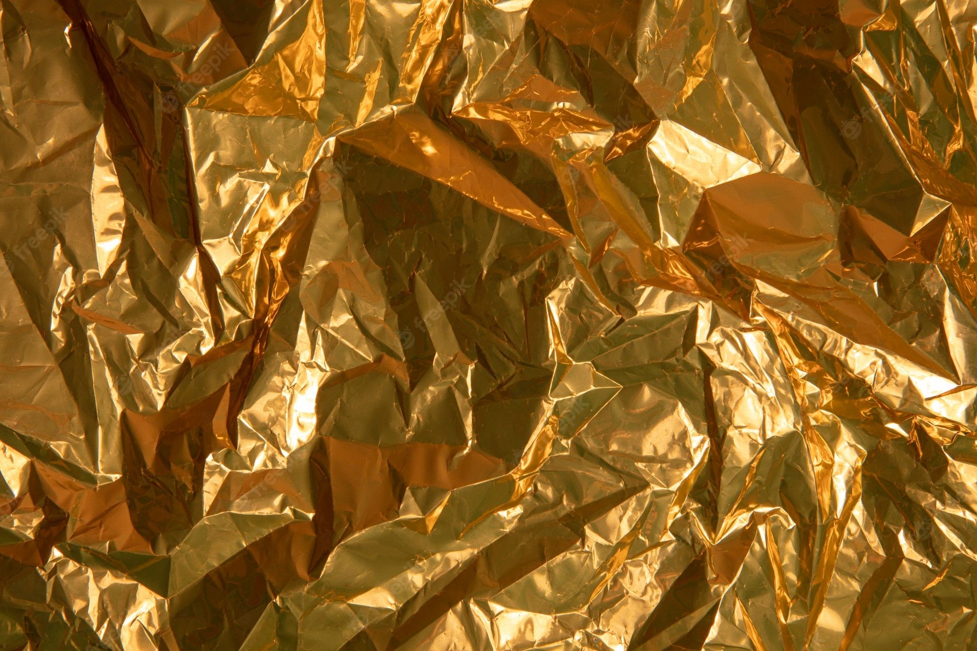 Gold foil background image with a crumpled texture - Gold