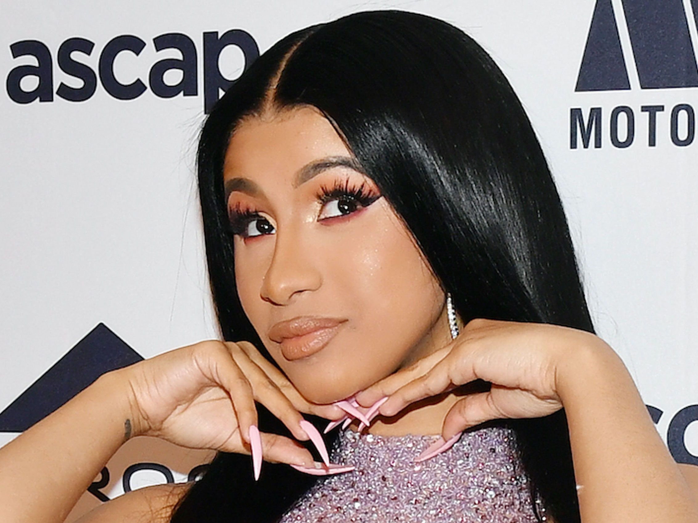 Cardi B poses for a photo on the red carpet - Cardi B