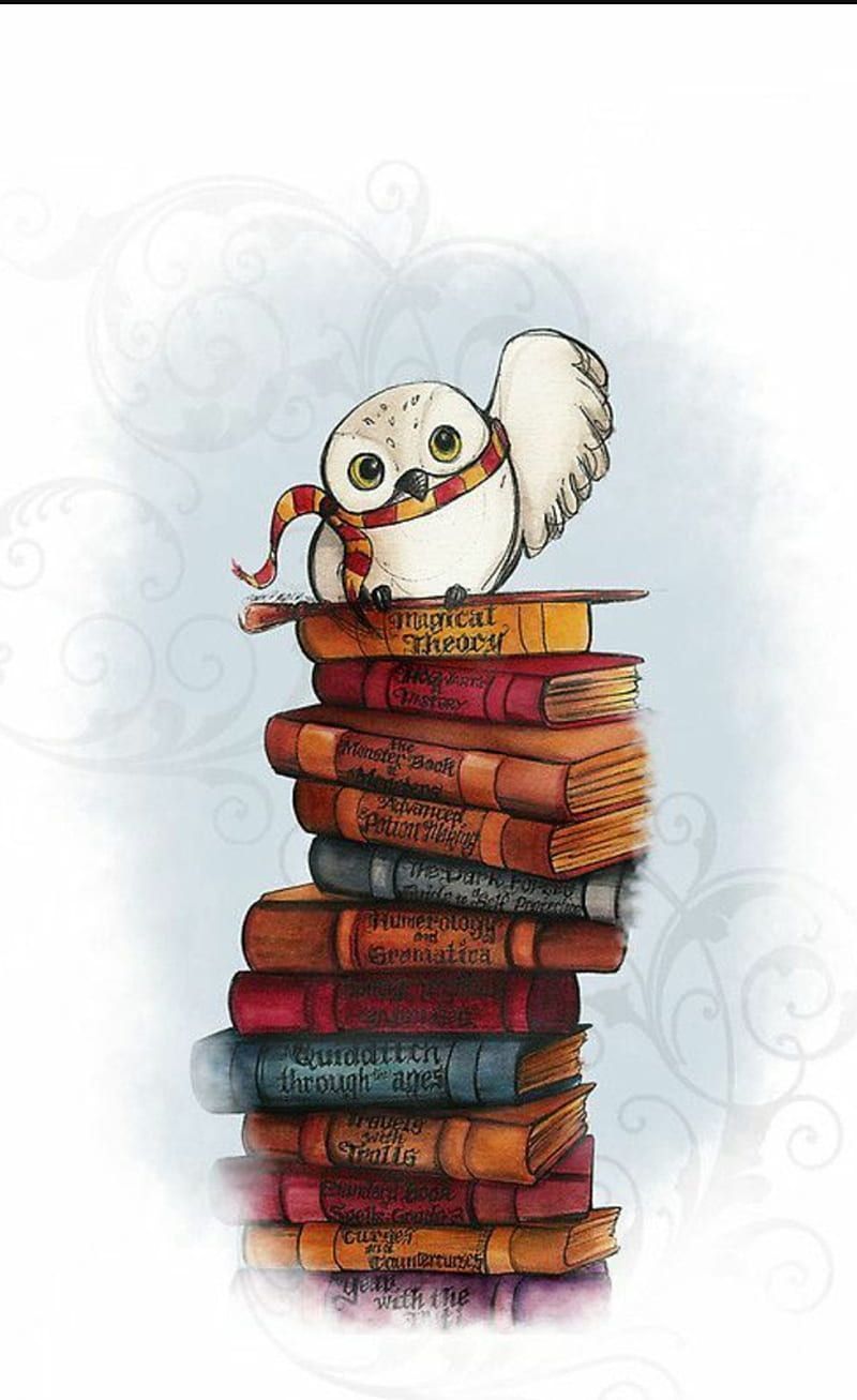 A white owl with big yellow eyes and a striped scarf, sitting on a pile of books. - Harry Potter