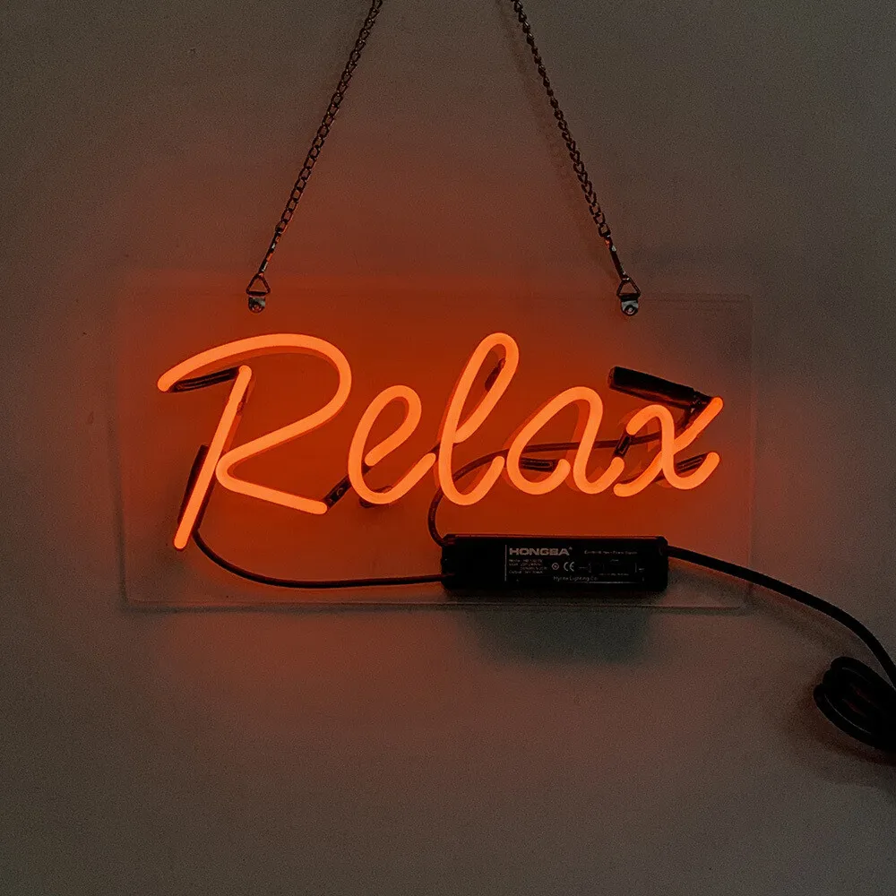 A neon sign that says Relax in orange. - Neon orange