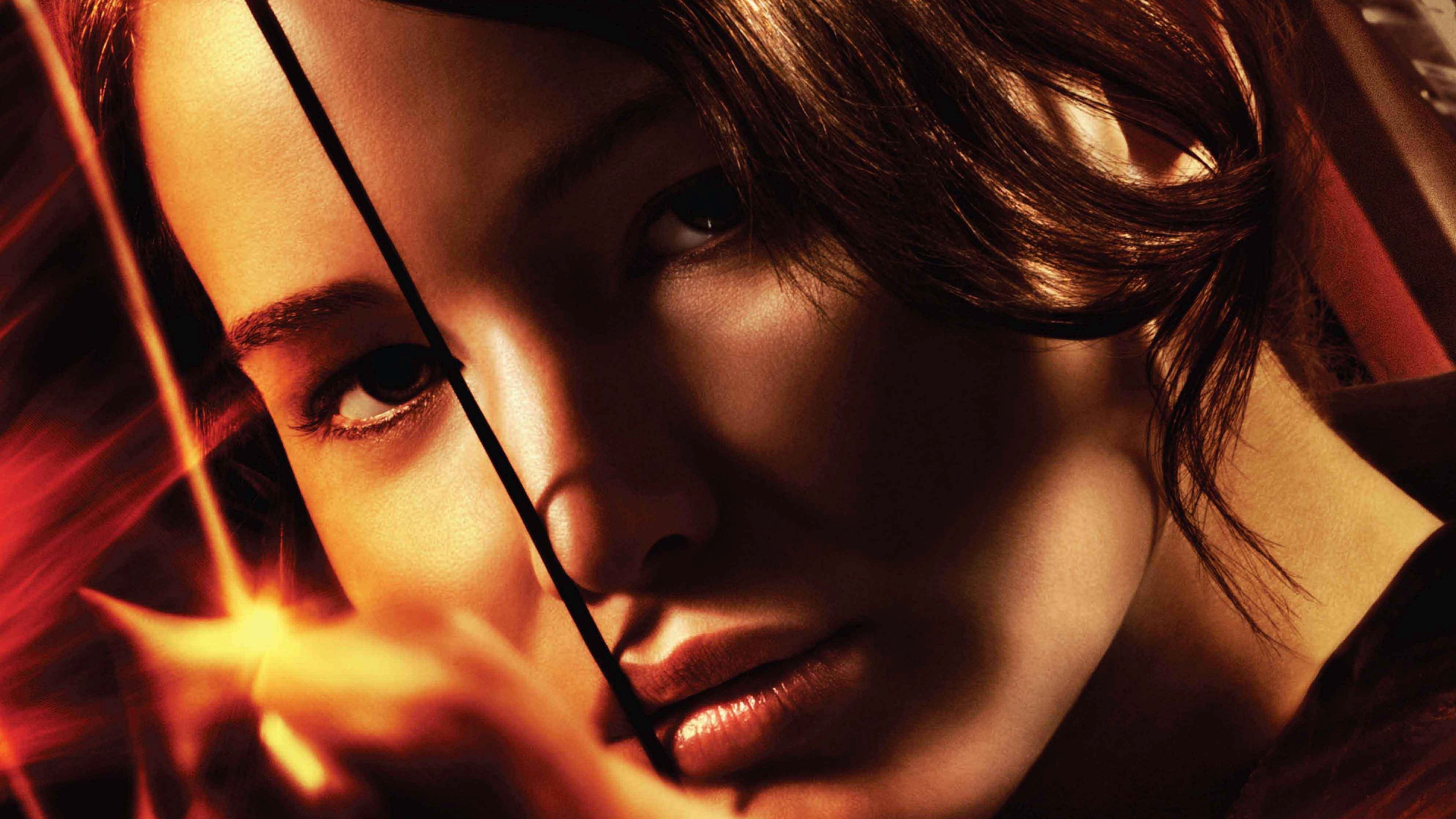 The Hunger Games movie poster with Katniss Everdeen holding a bow and arrow. - Jennifer Lawrence