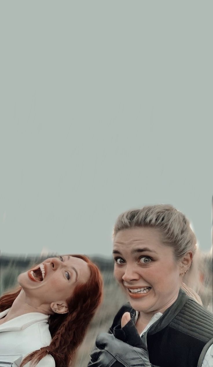 A photo of two women smiling and taking a selfie. - Florence Pugh
