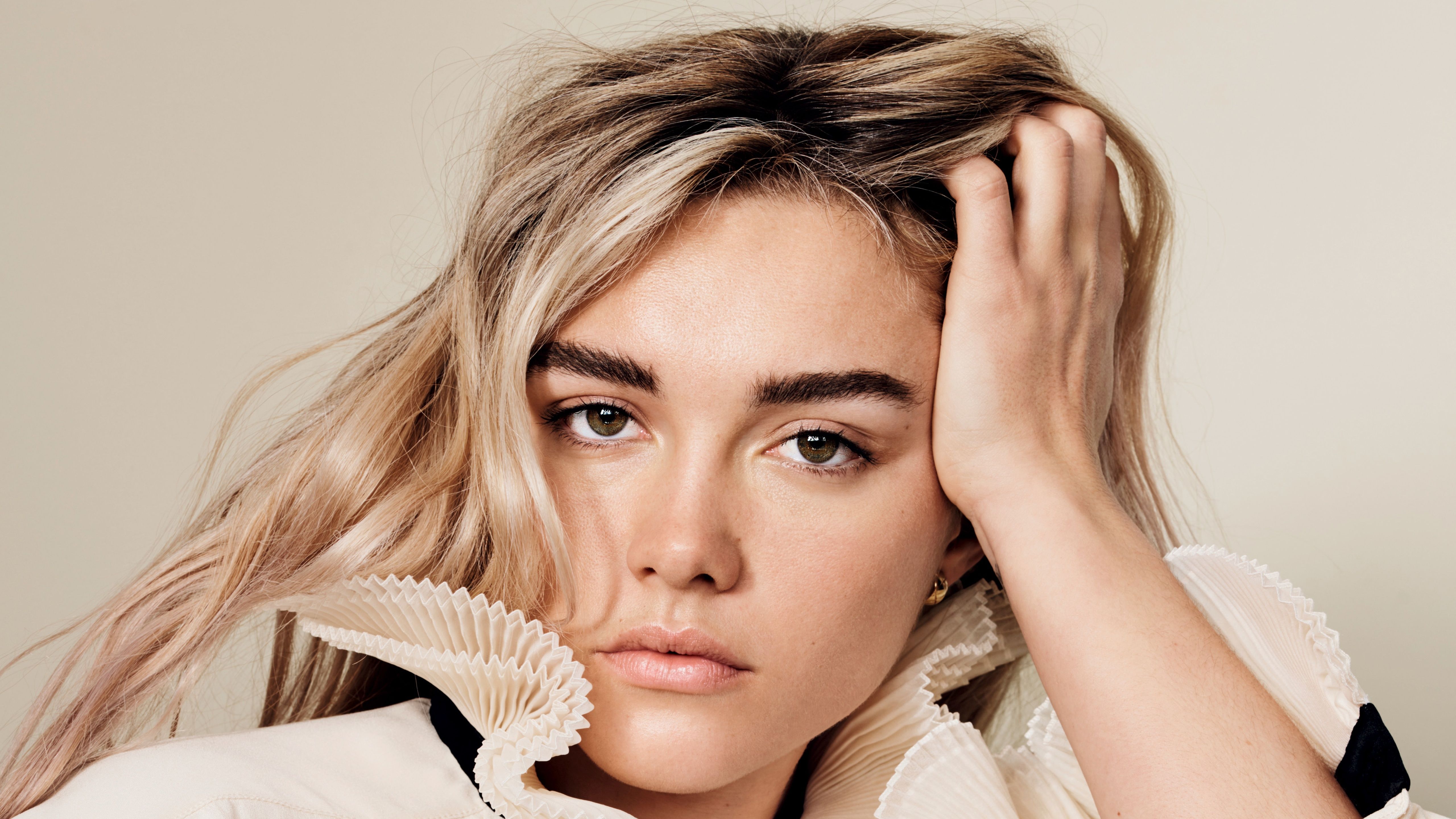 Portrait of a young woman with hand in hair - Florence Pugh