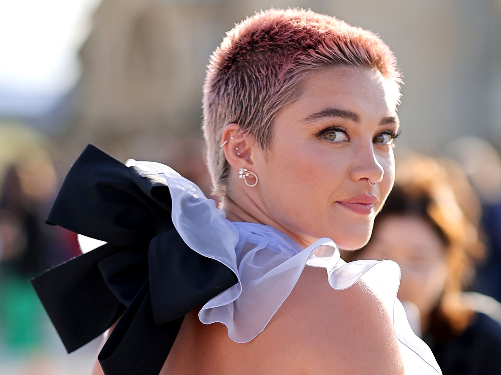 Paris Jackson with a pink buzz cut and a bow in her hair - Florence Pugh