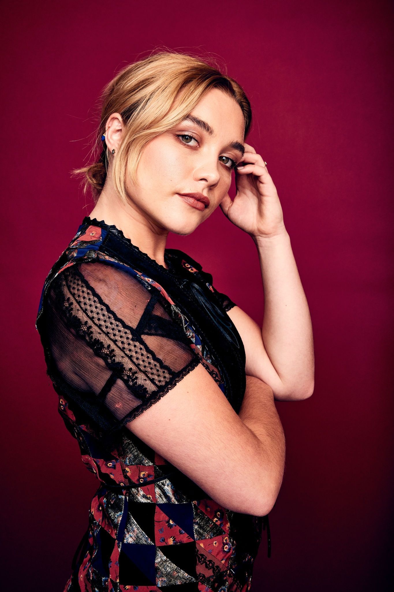 Saoirse Ronan in a floral top holding her hair - Florence Pugh