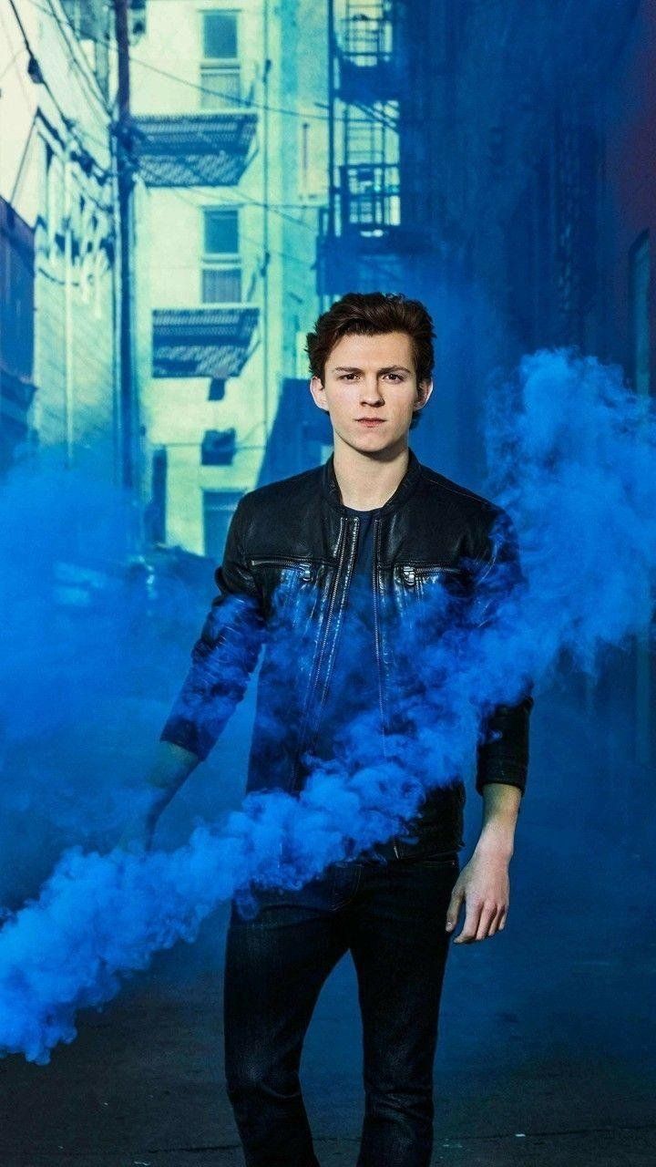 Tom Holland standing in the street with blue smoke - Tom Holland