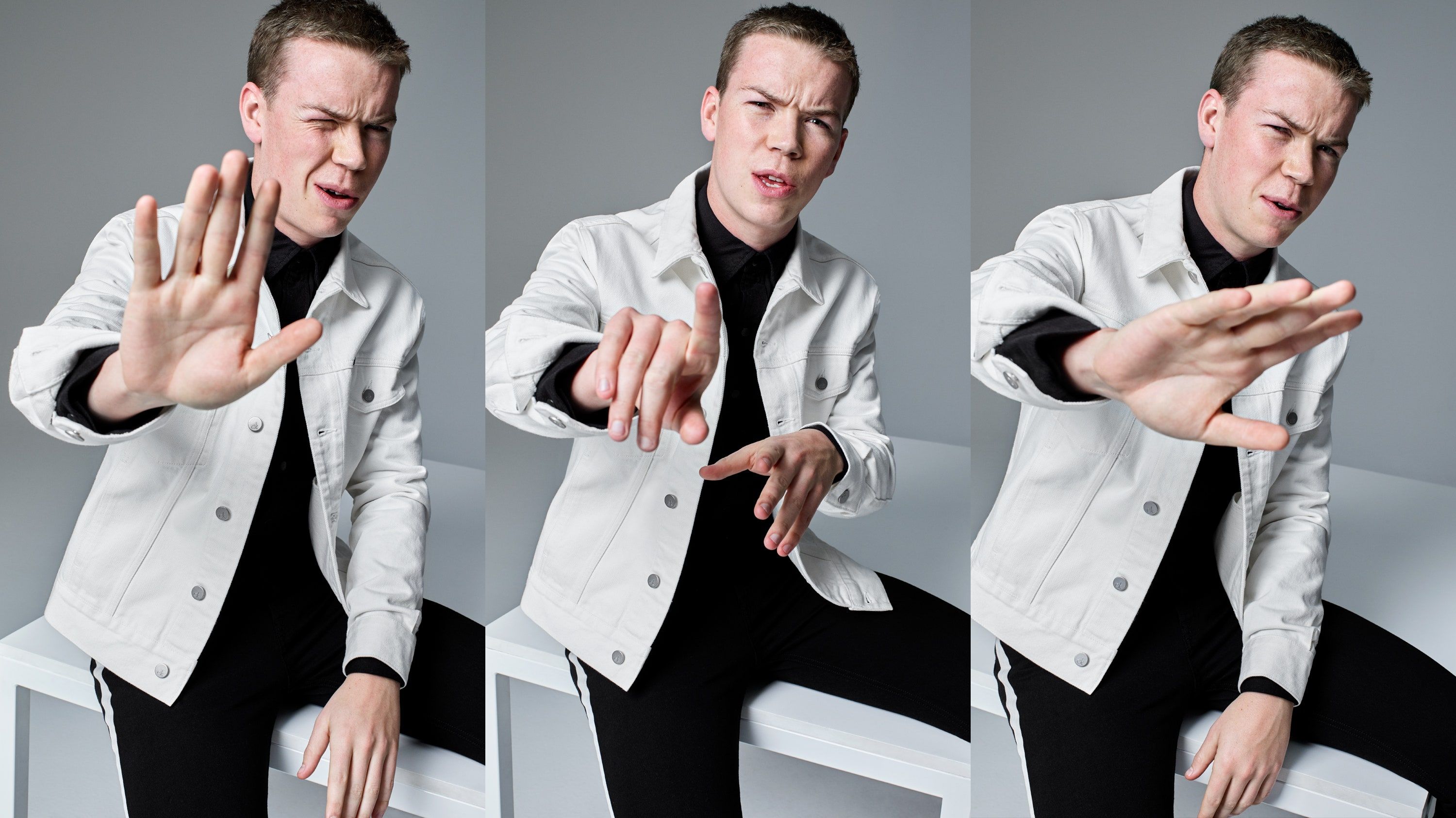 Three images of a man wearing a white jean jacket and black shirt making hand gestures - Will Poulter