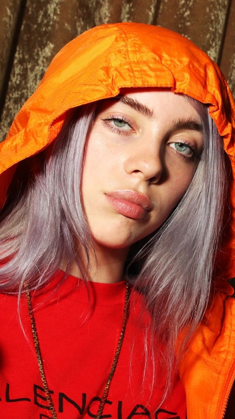 Billie Eilish with a grey hair and orange hood - Billie Eilish