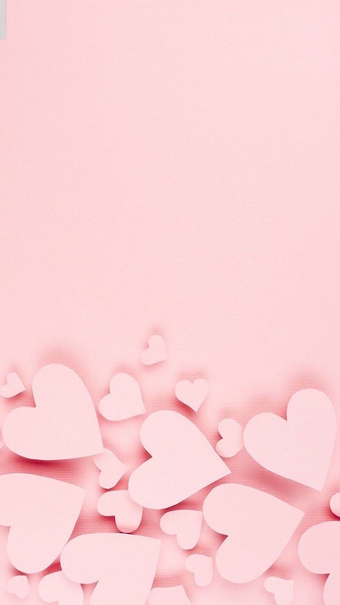 A pink background with hearts on it - Valentine's Day