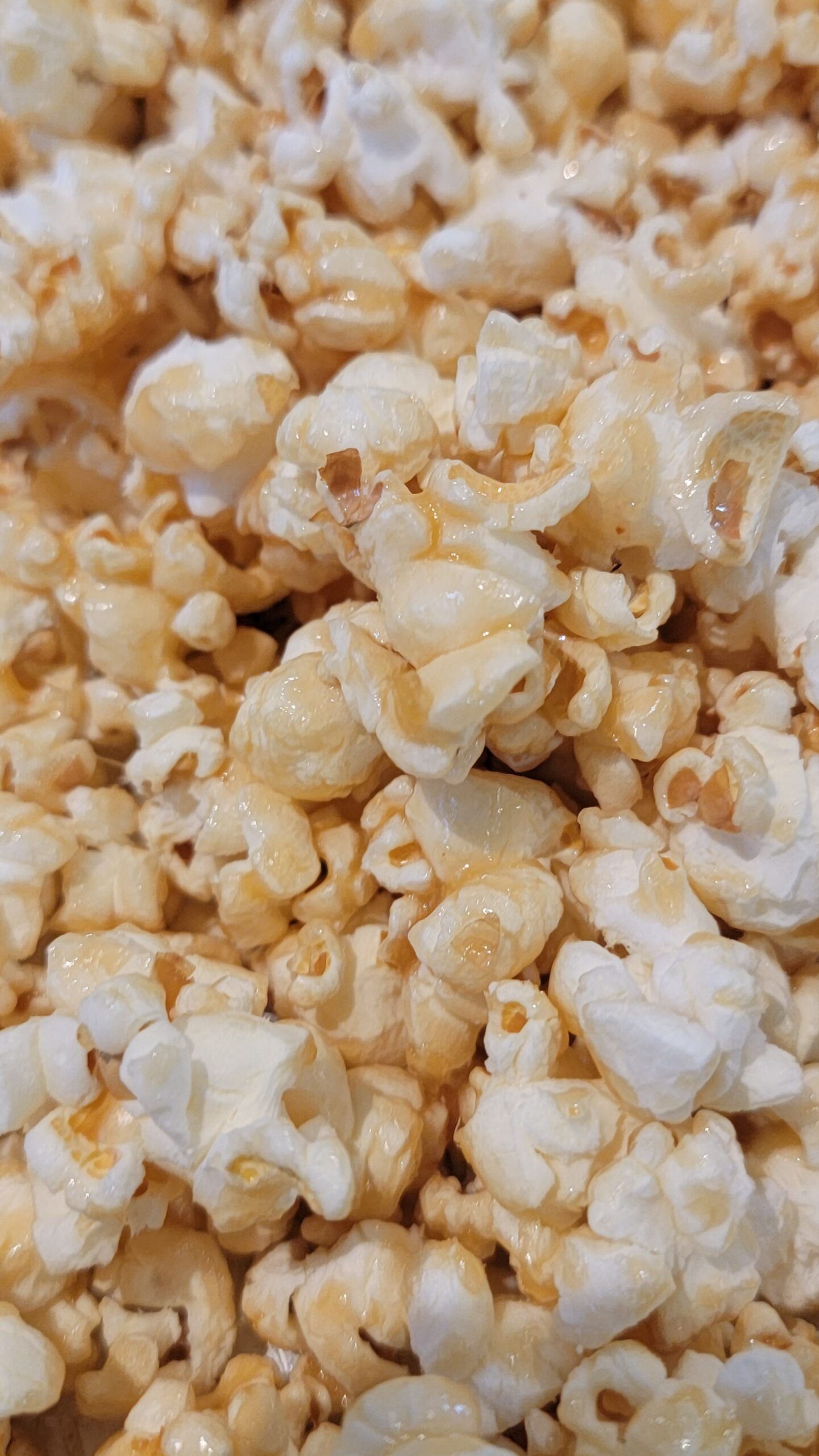 A pile of caramel coated popcorn. - Popcorn