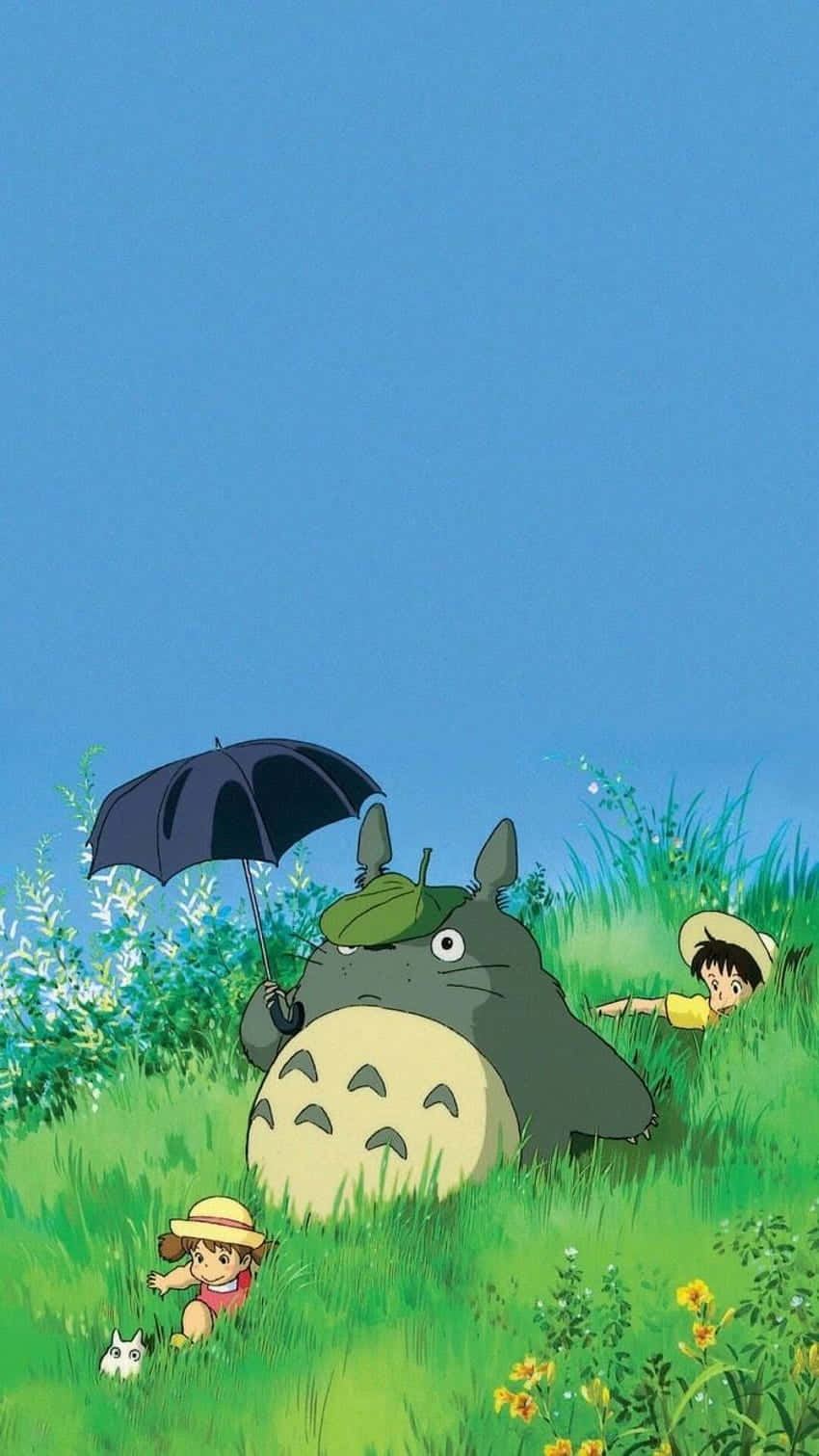 Download a totoro and a girl with an umbrella in the grass Wallpaper