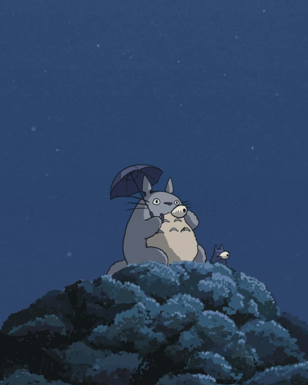 Download a totoro sitting on a rock with an umbrella Wallpaper