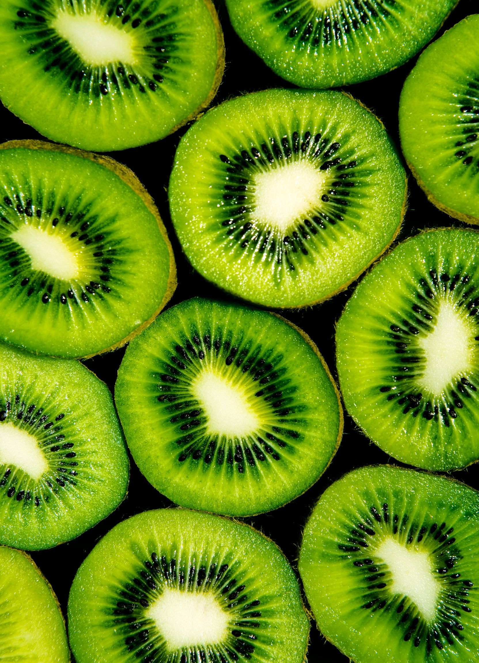 A close up of green kiwi slices - Kiwi