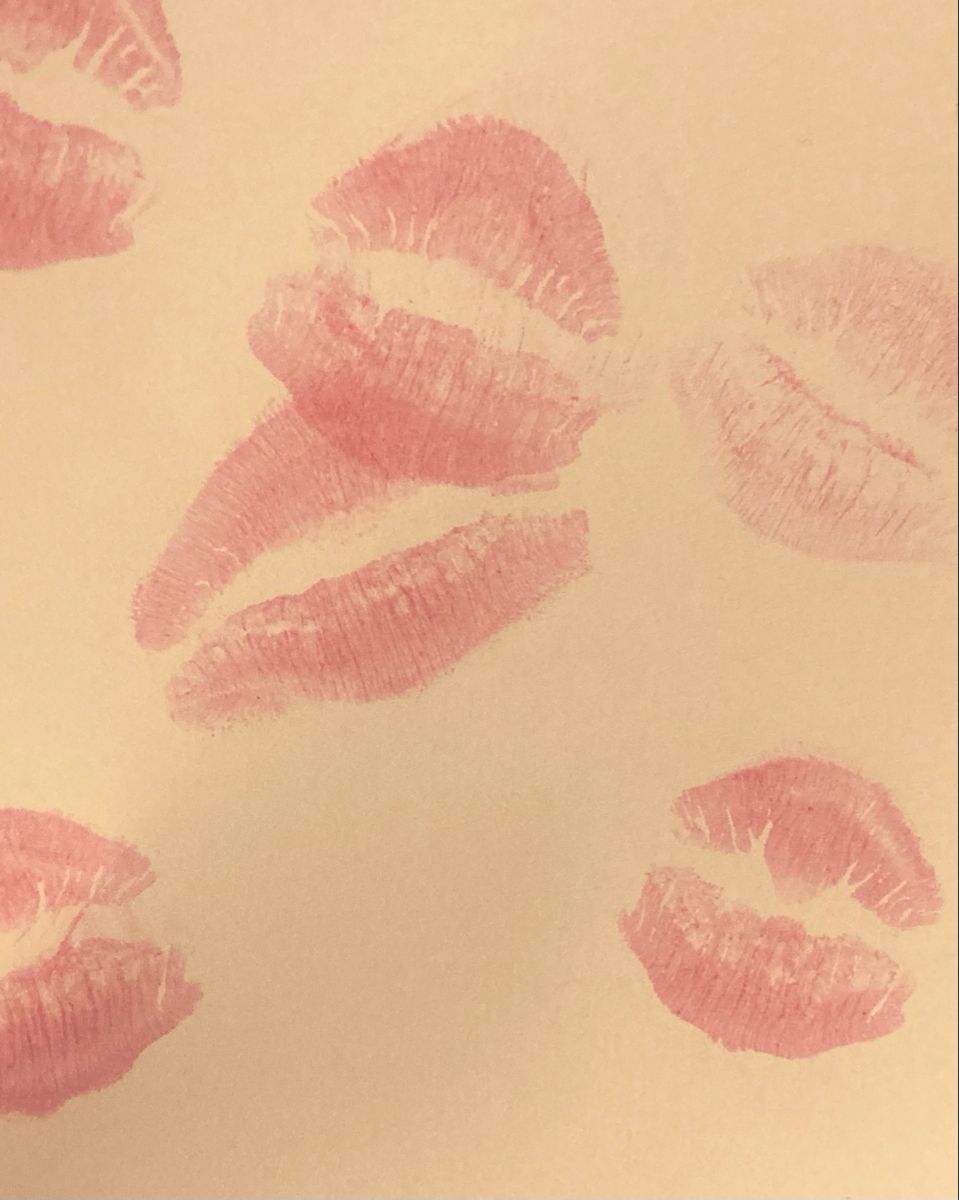 Several kiss prints in red lipstick on a piece of paper - Lips