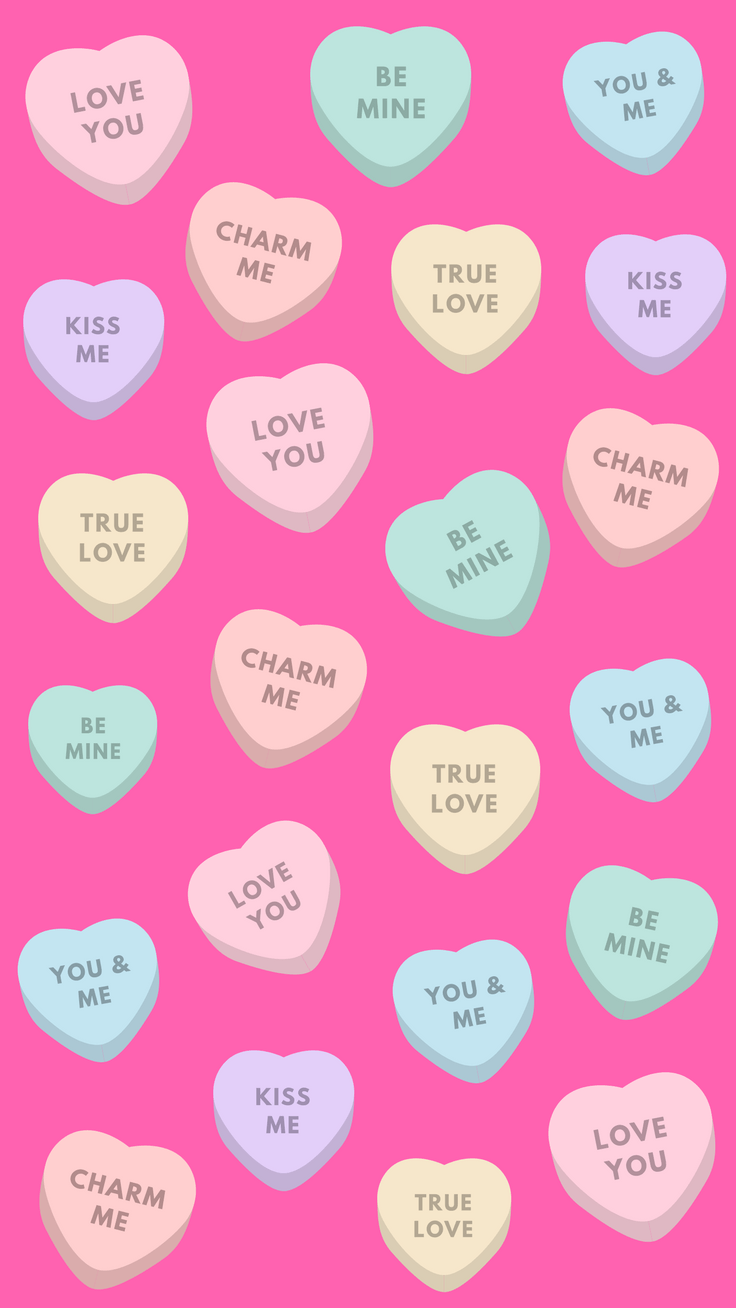 A bunch of candy hearts on pink background - Valentine's Day