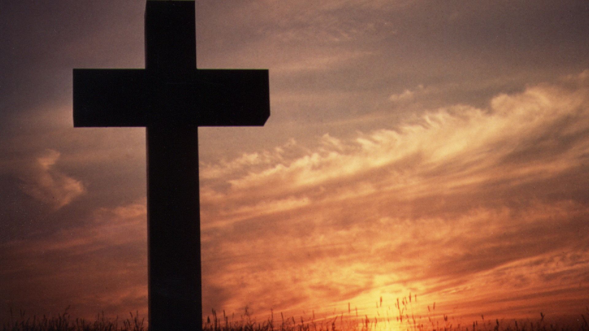A cross silhouetted against a sunset - Cross