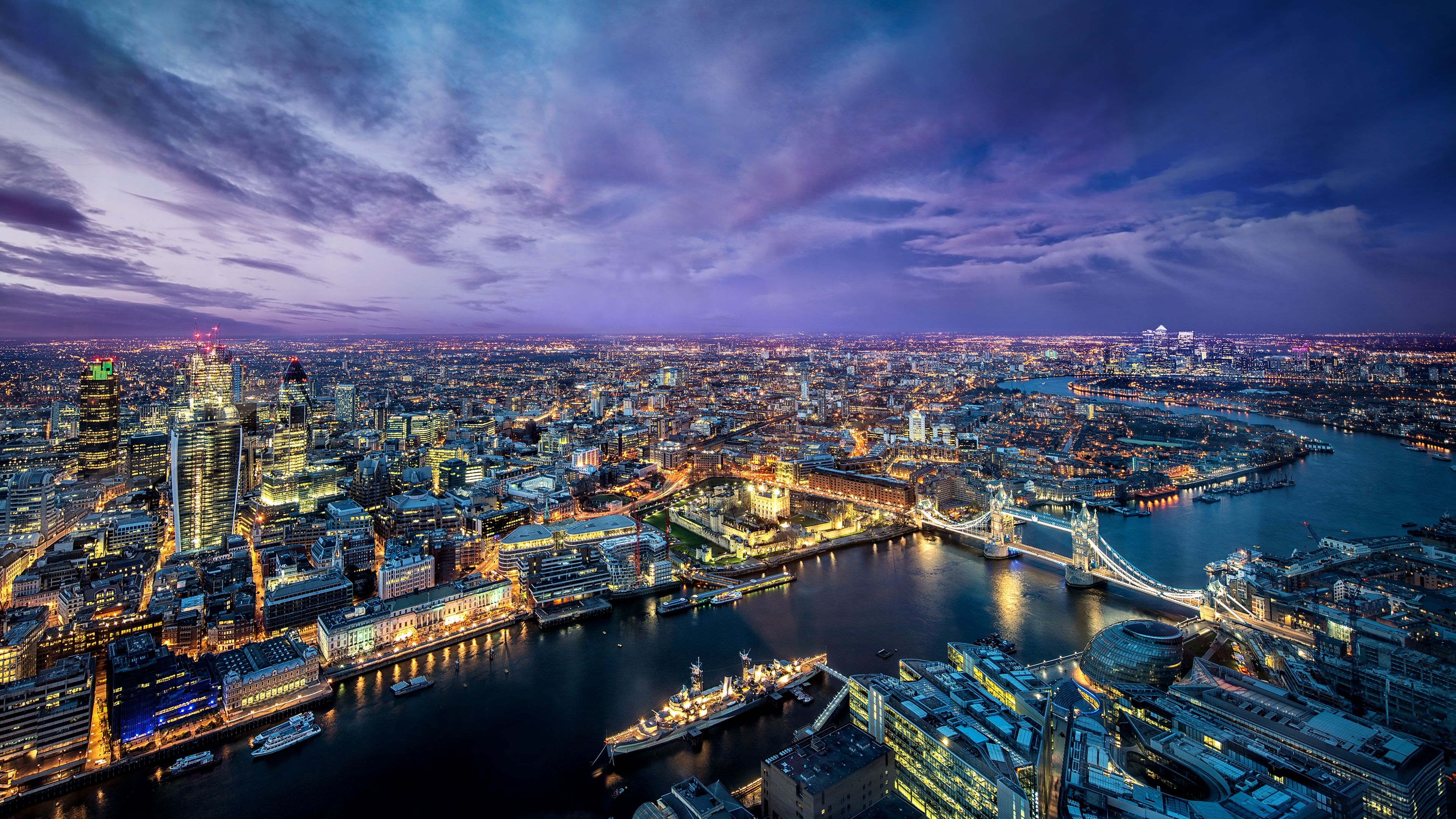 London's skyline at night, with the Tower Bridge and the Shard. - London