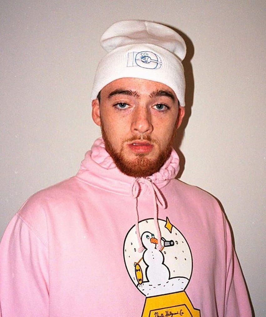 Mac Miller in a pink hoodie and a white beanie - Angus Cloud