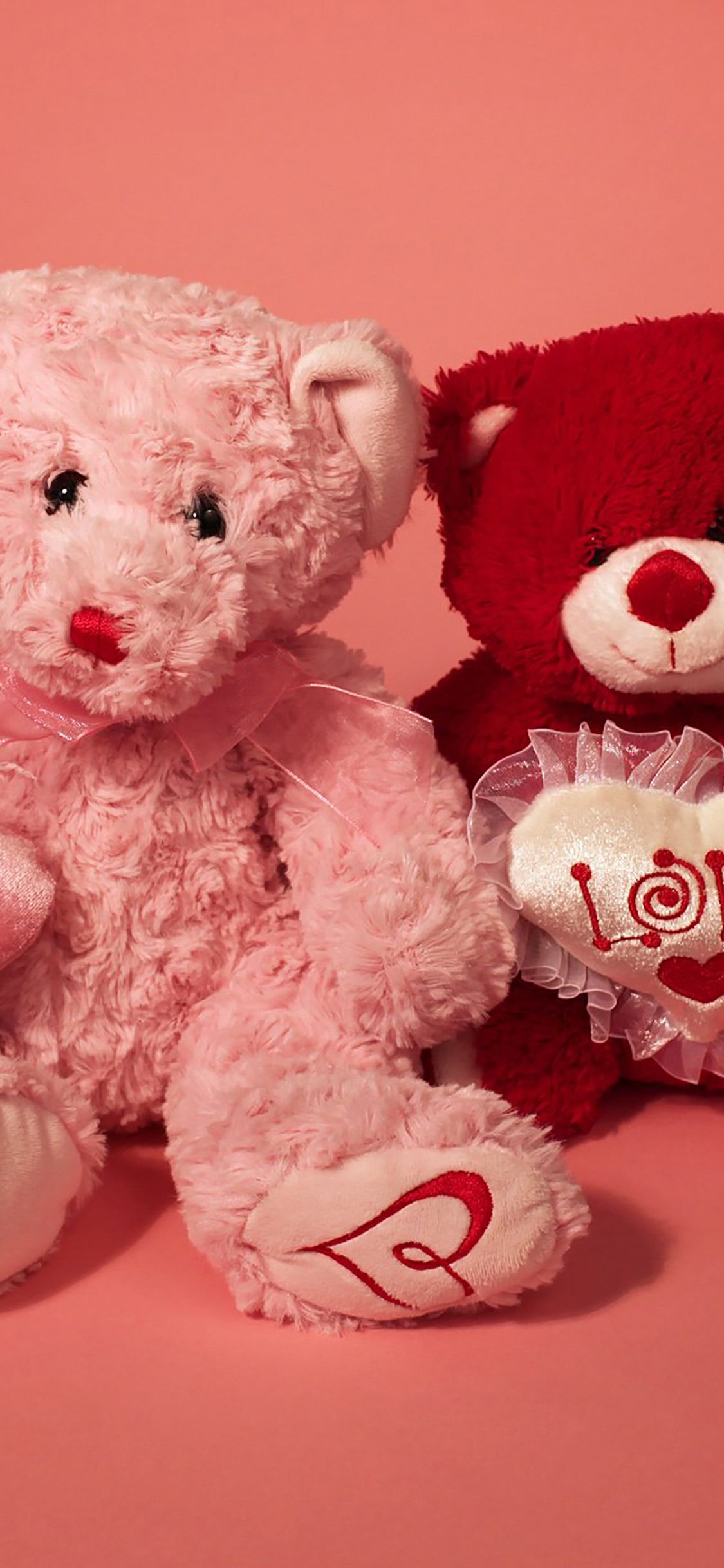 A couple of teddy bears sitting next to each other - Valentine's Day