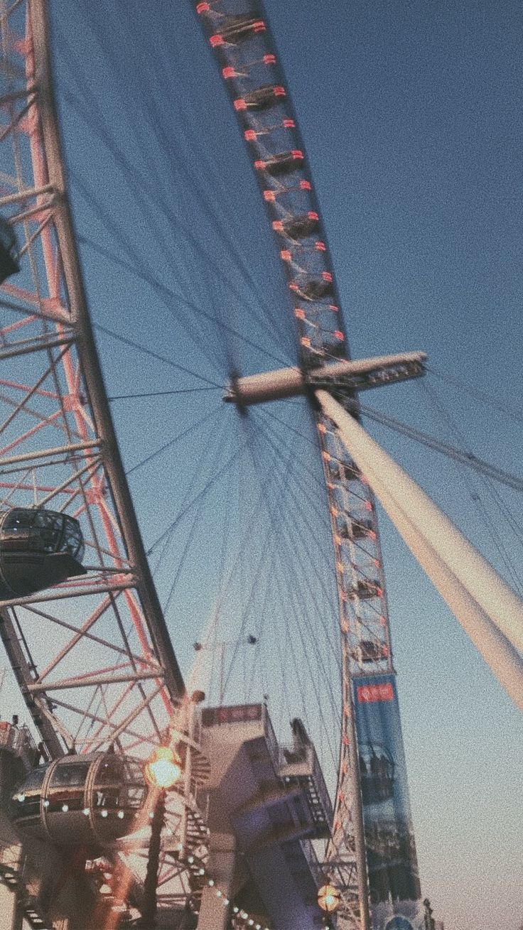 A ferris wheel with people on it - London