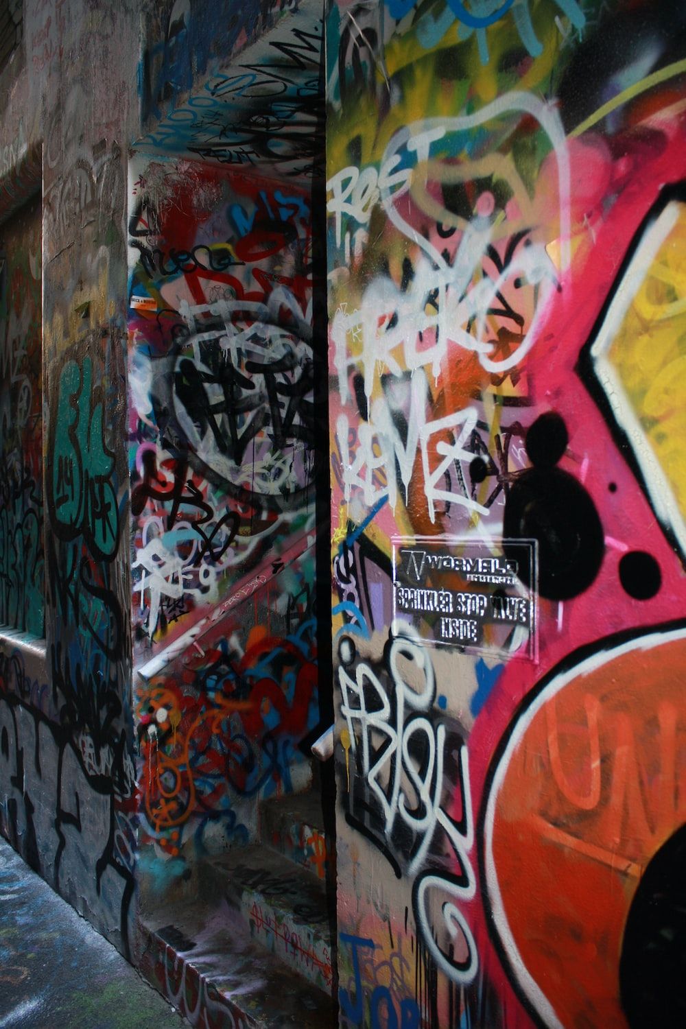 graffiti wall alley during daytime photo