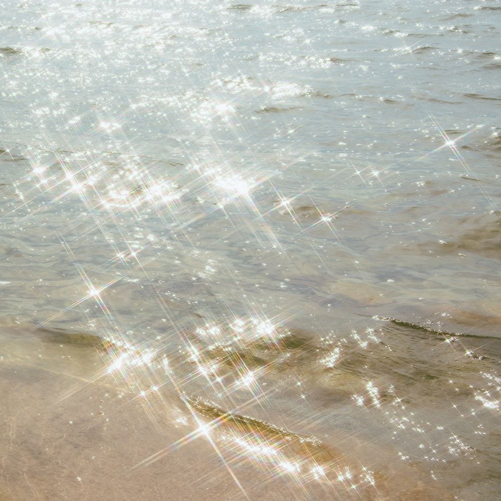Sparkling sunlight on the surface of the water - Bling, glitter